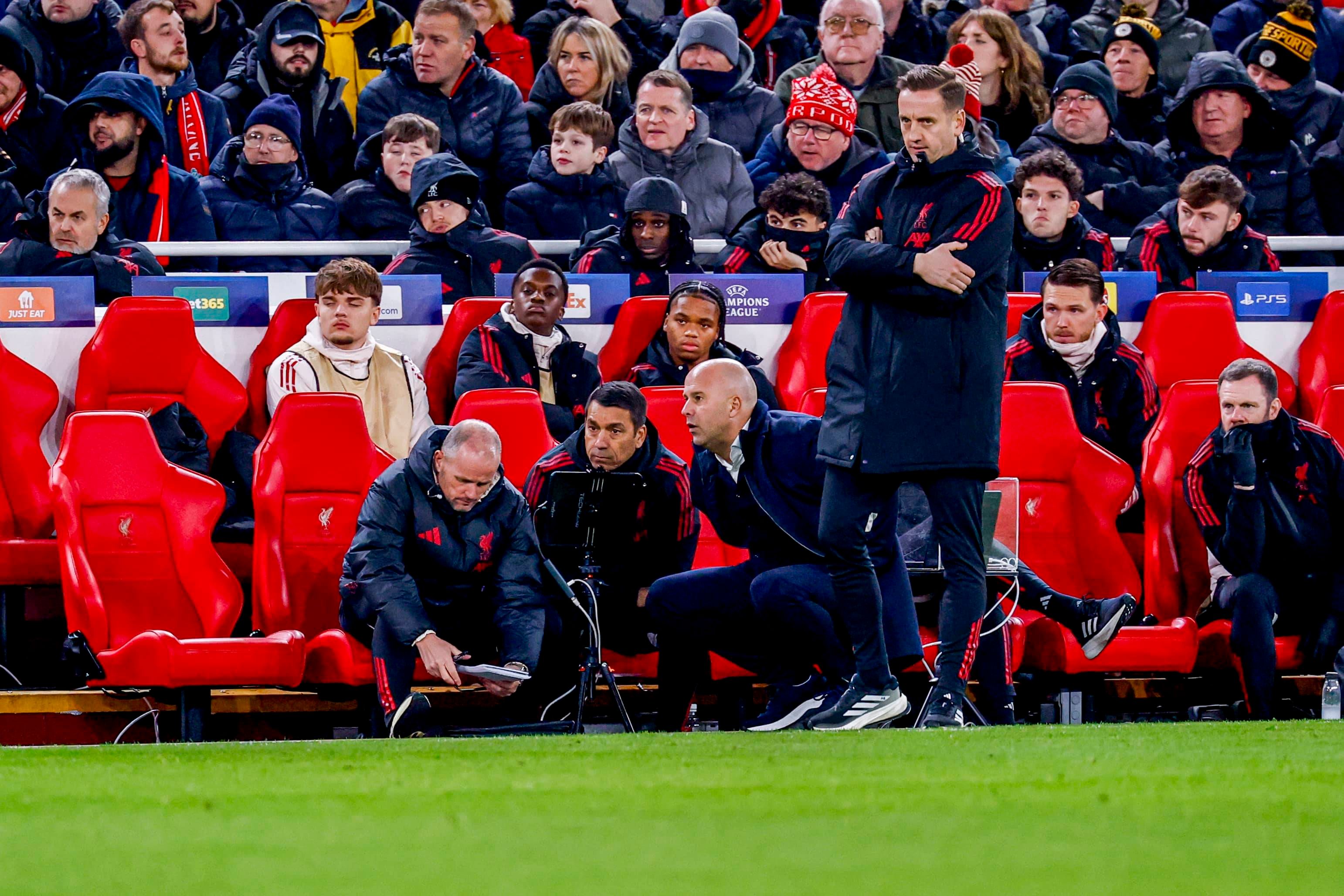 assistant coach Sipke Hulshoff of Liverpool FC and assistant coach Giovanni van Bronckhorst of Liverpool FC and head coach Arne Slot of Liverpool FC in discussion Liverpool FC v PSV Eindhoven, UEFA Champions League 2025 26 League Phase MD5, Liverpool FC v PSV Eindhoven, Anfield, November 26, 2025, Liverpool, United Kingdom.