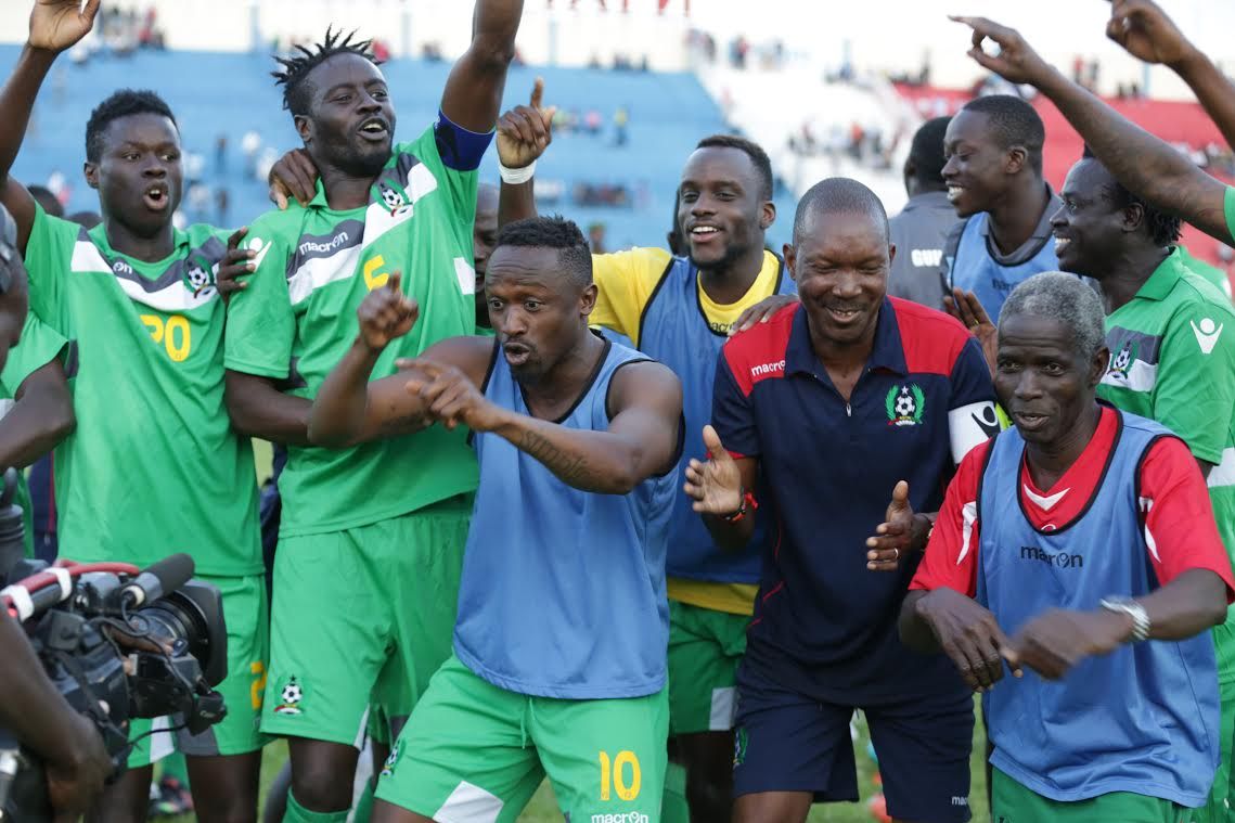 Guinea Bissau players celebrate at the final whistle as the win takes them on top of Group E