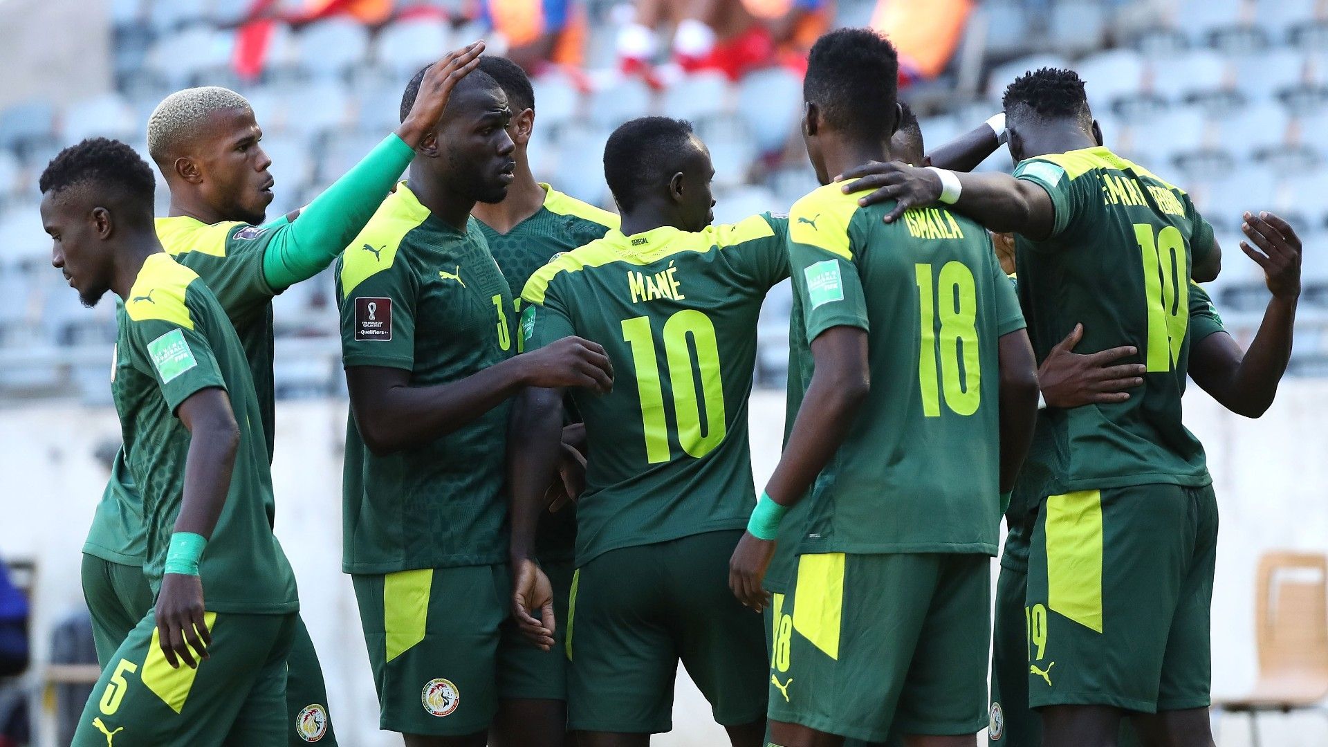 Famara Diedhiou of Senegal is congratulated for scoring his and Senegal.