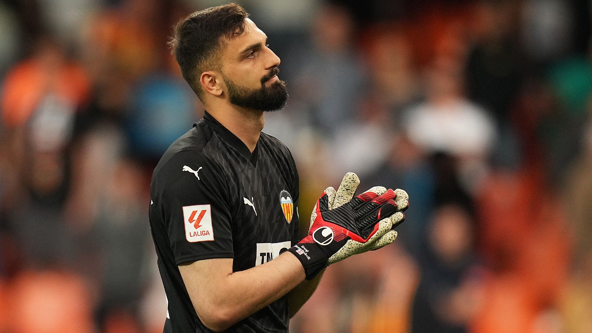 Giorgi Mamardashvili of Valencia CF applauds the fans 