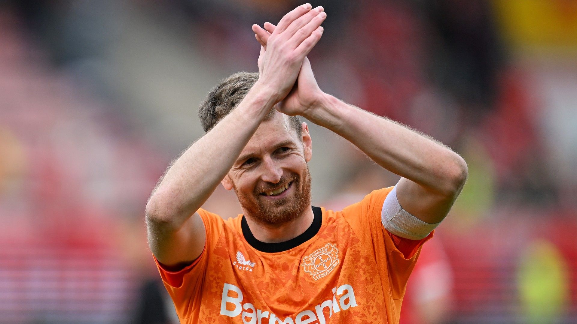 Lukas Hradecky of Bayer 04 Leverkusen applauds the fans   