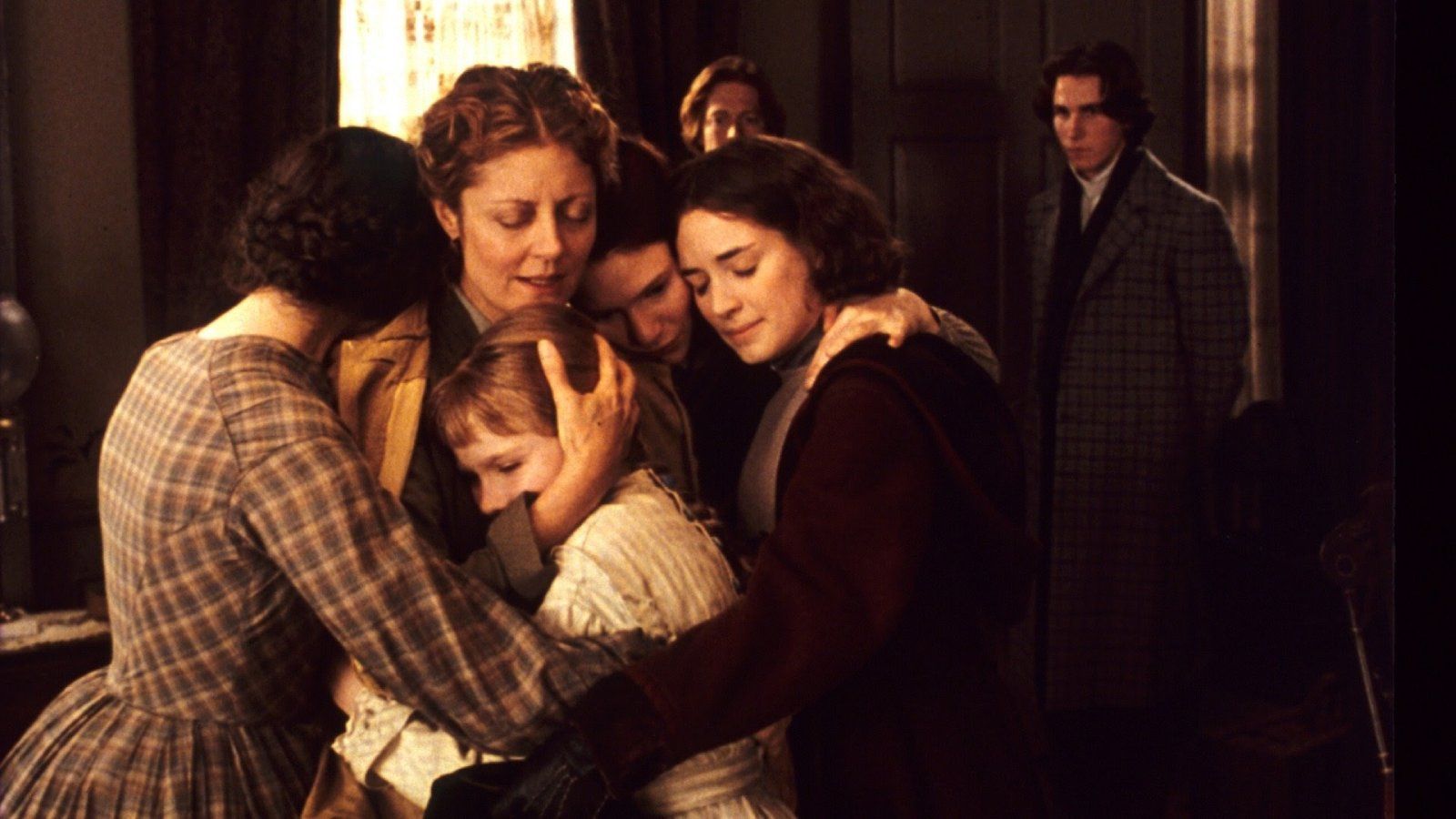 Jo and her family embracing one another in Little Women (1994).