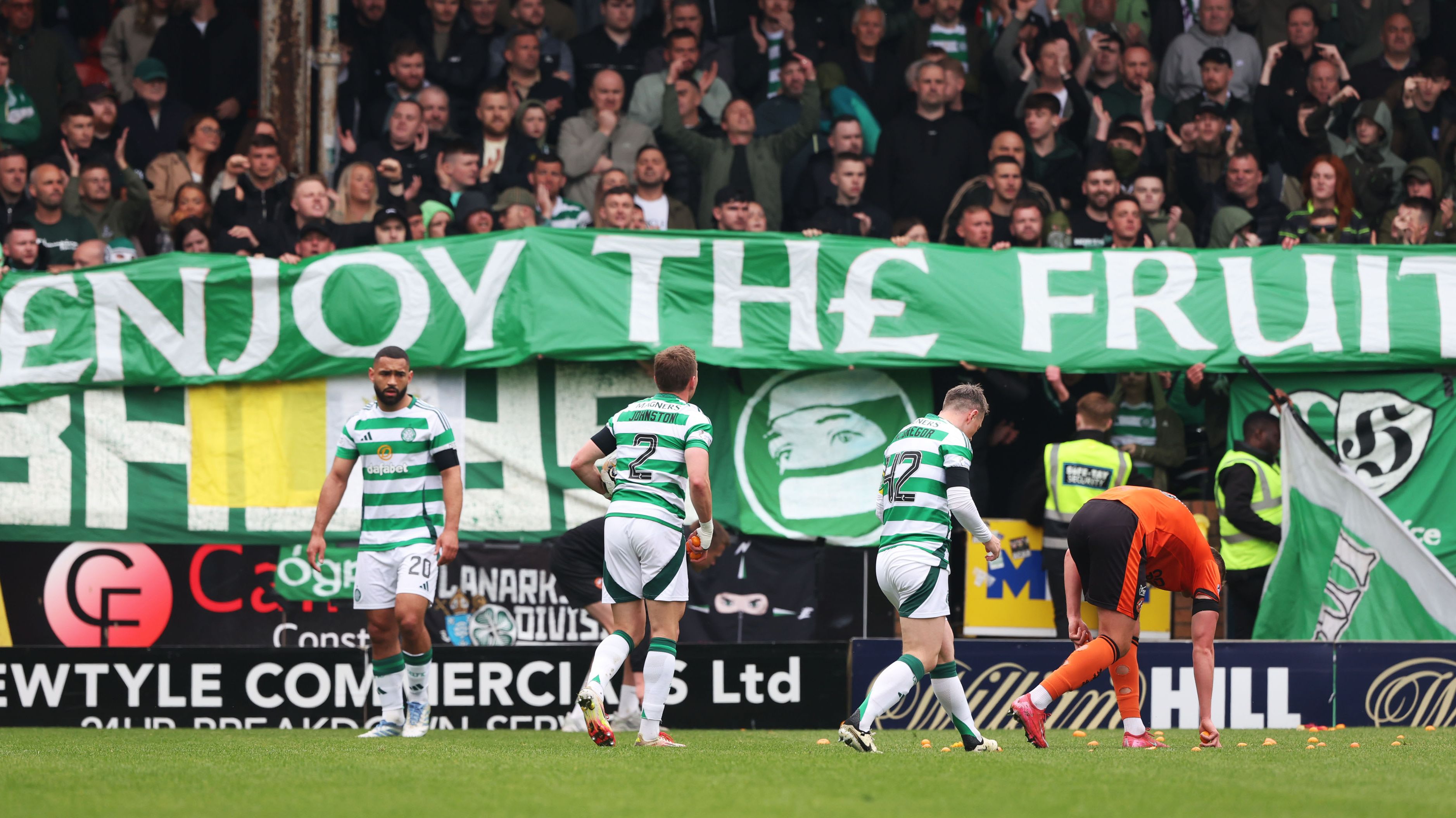 WATCH: Game stopped for tangerines! Celtic's match at Dundee United temporarily suspended after fan protest sees fruit thrown onto pitch | Goal.com UK