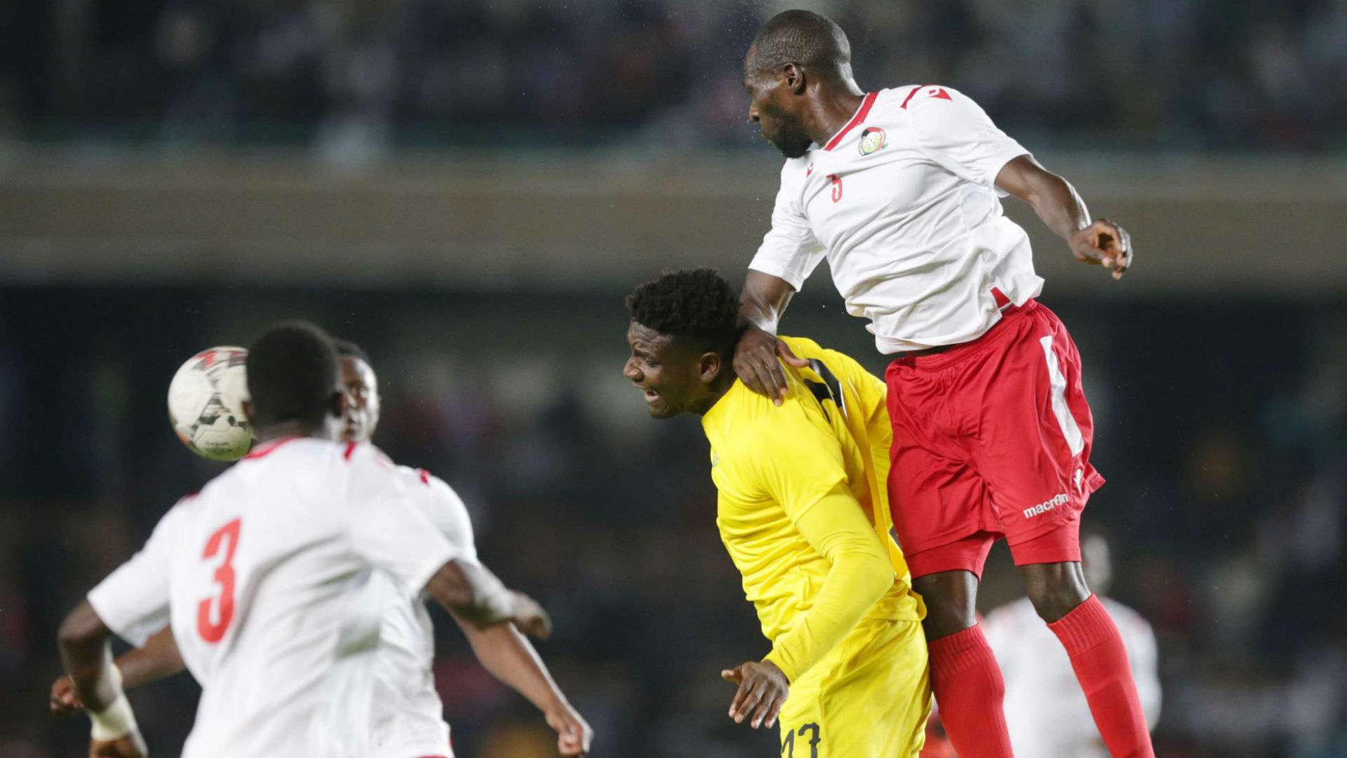 Joash Onyango of Kenya and Harambee Stars vs defends against Peniel Kokou of Togo.