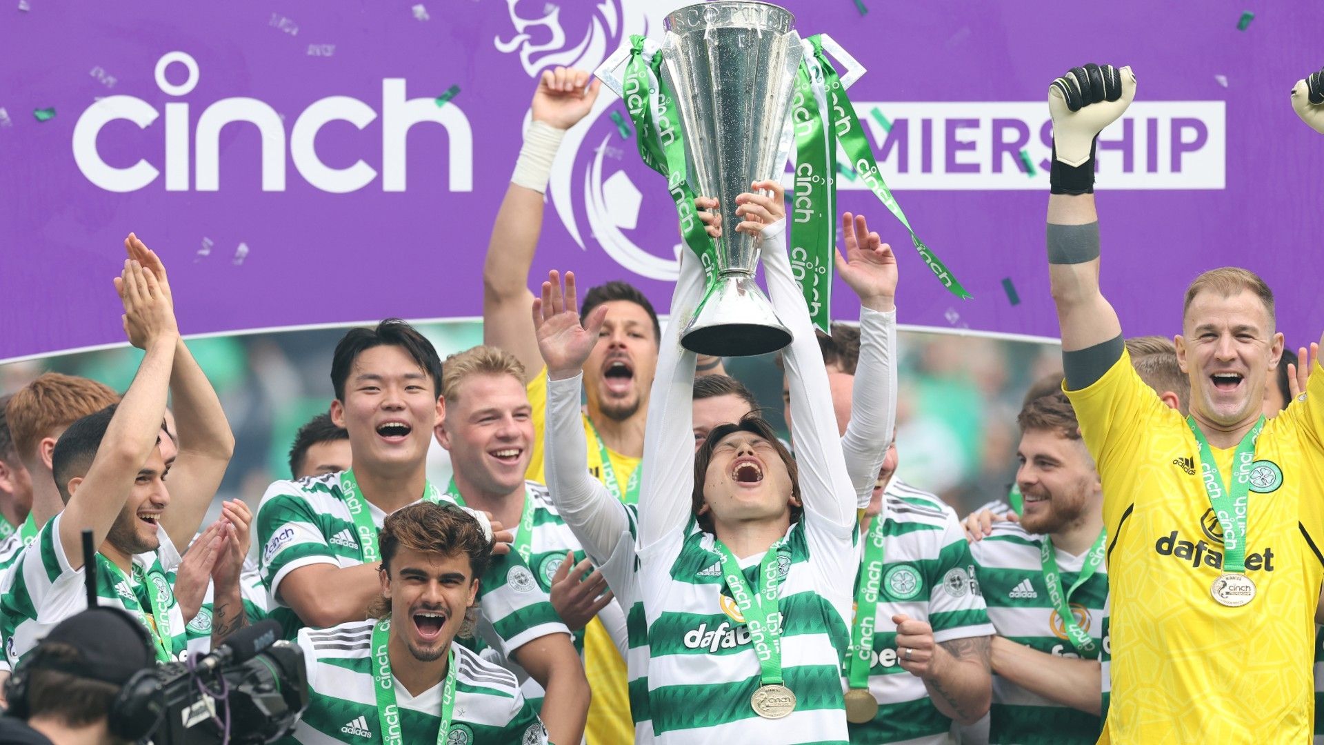 Kyogo Furuhashi of Celtic is seen with the trophy
