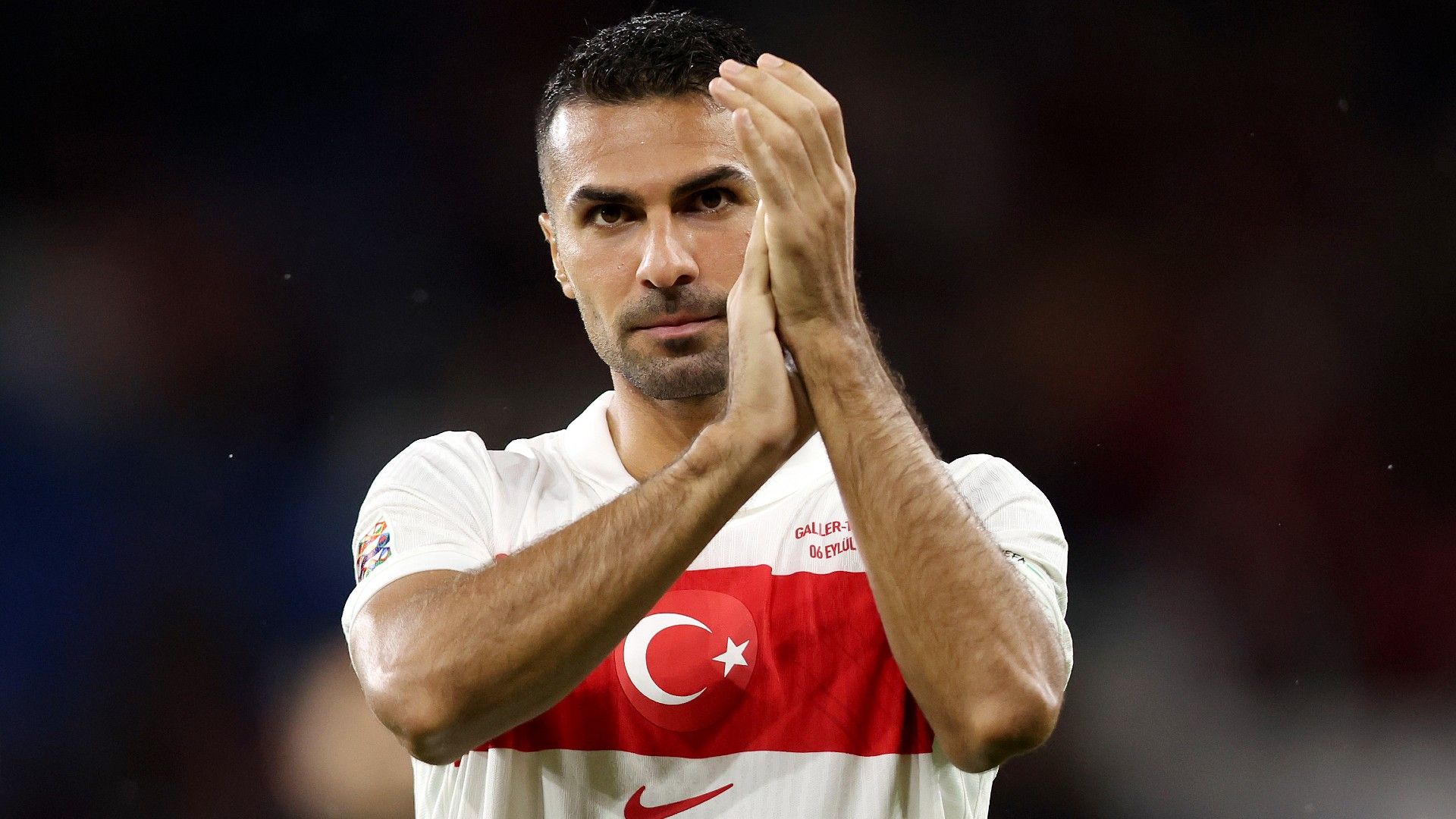 Zeki Celik of Turkiye applauds the fans