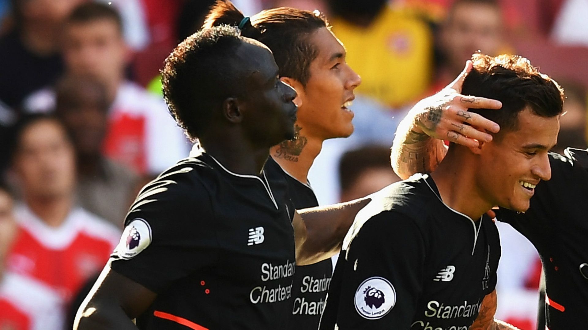 Sadio Mane and Phil Coutinho celebrate