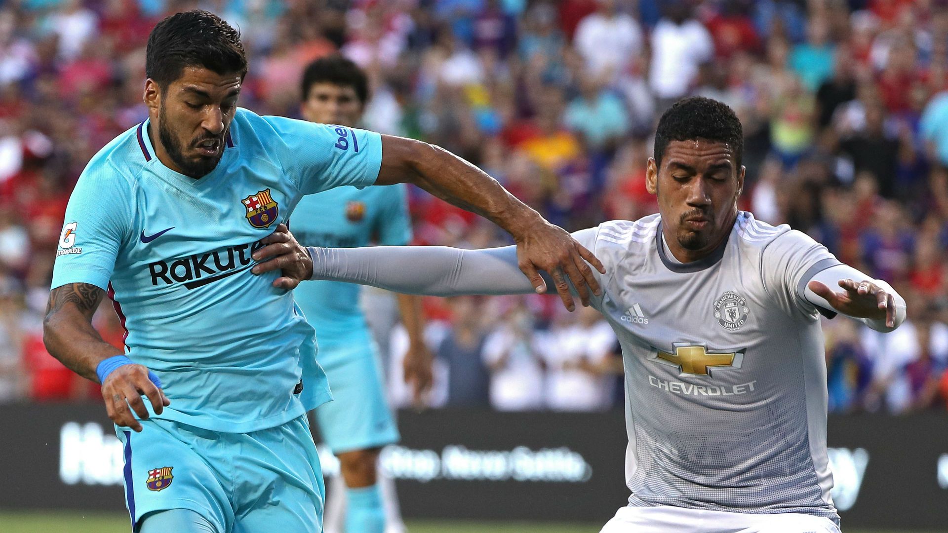 Luis Suarez Chris Smalling - cropped