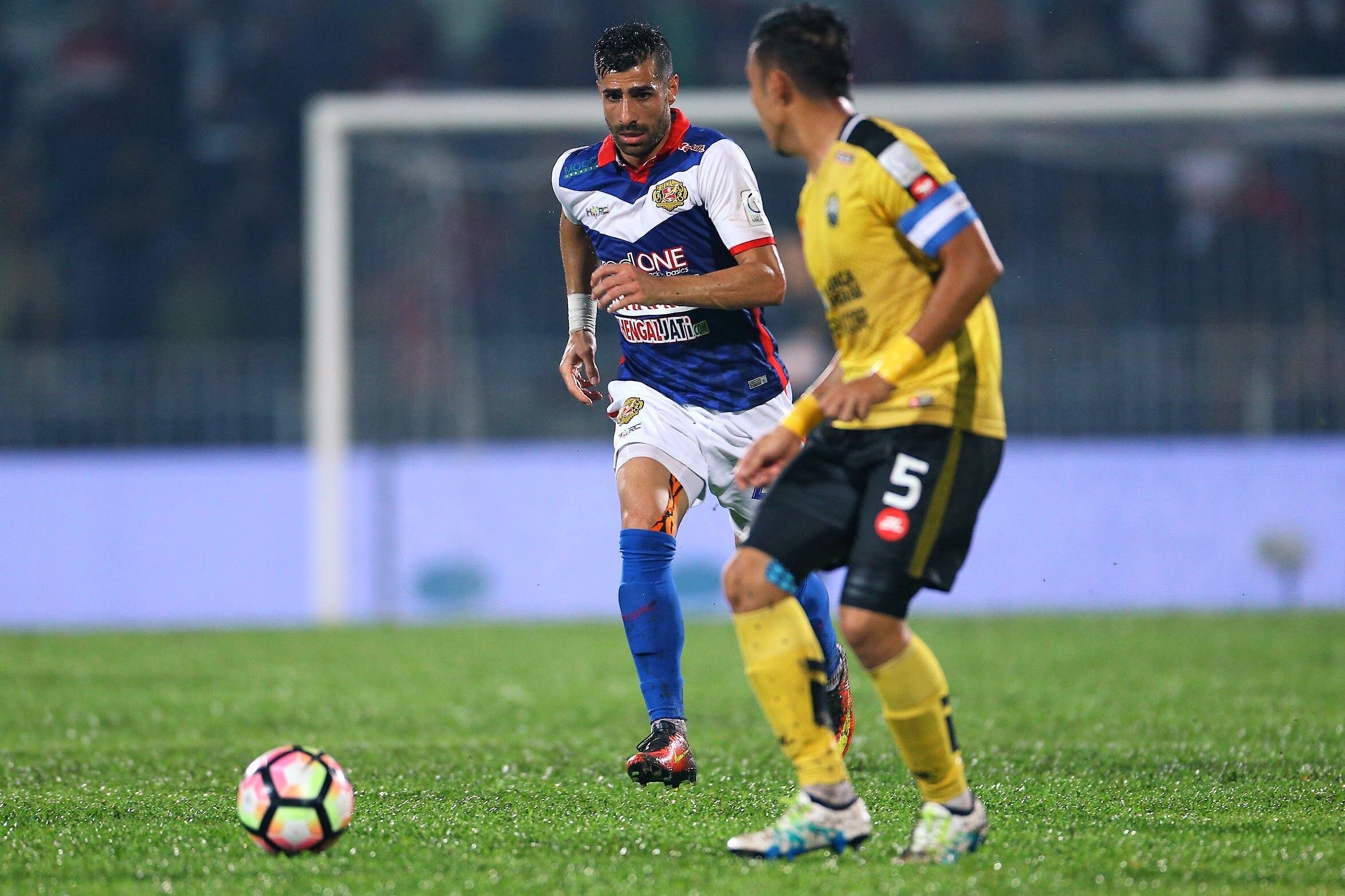 Kelantan's Mohammed Ghaddar (left) playing against Perak 1/3/2017