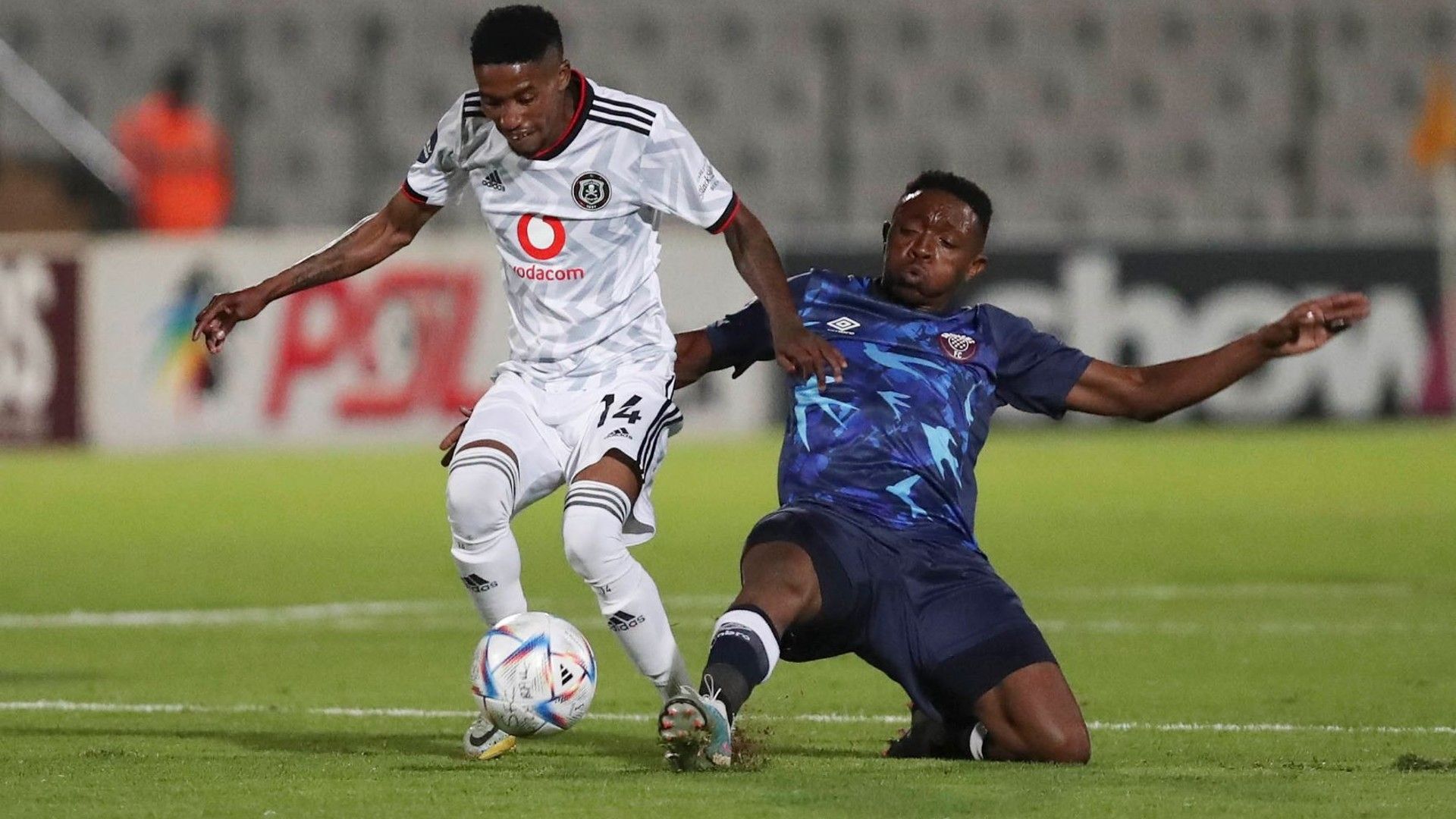 Monnapule Saleng tackled by Tlakusani Mthethwa of Swallows FC.