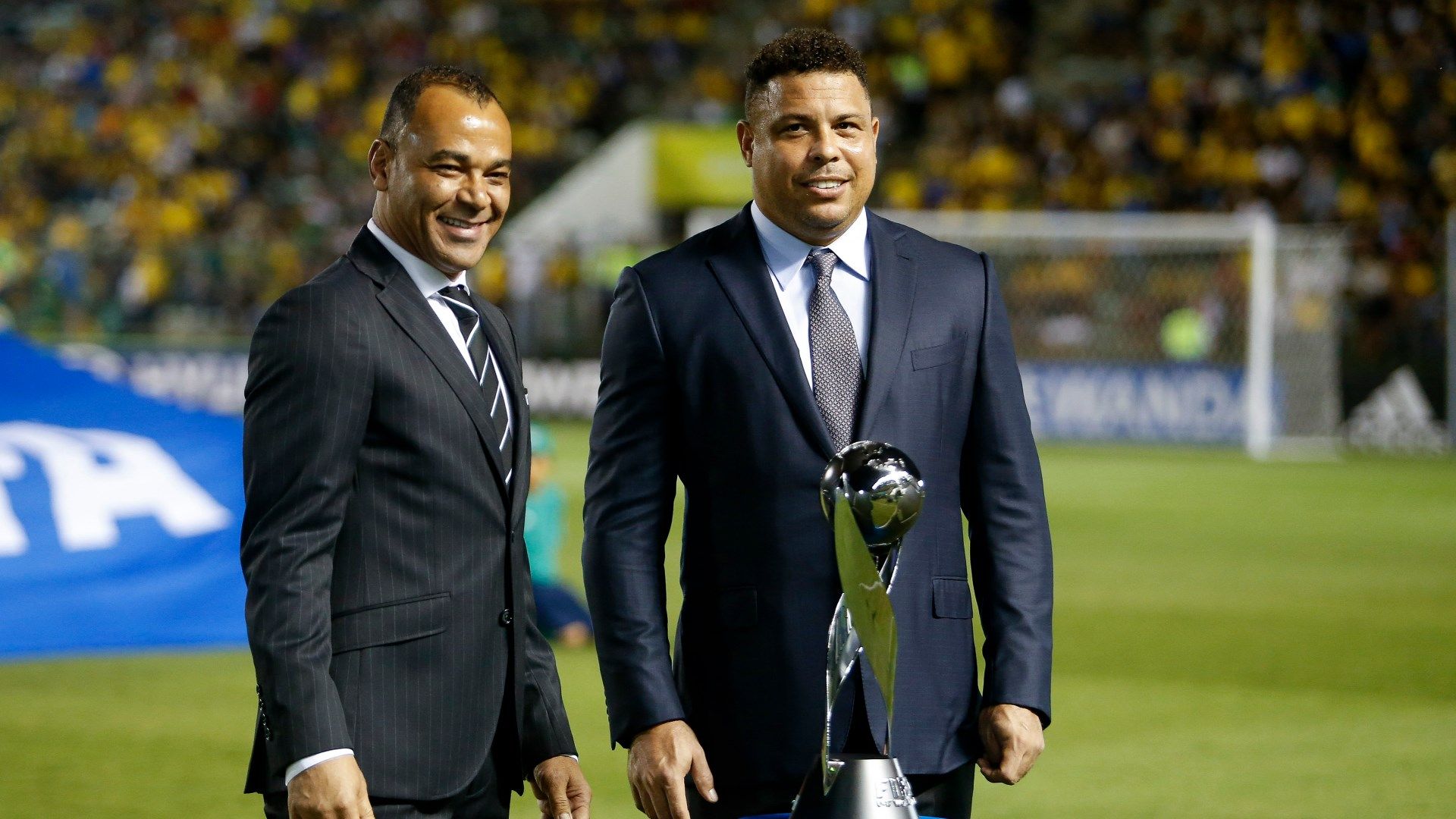 Former Brazil players Cafu Ronaldo Nazario with U17 World Cup trophy