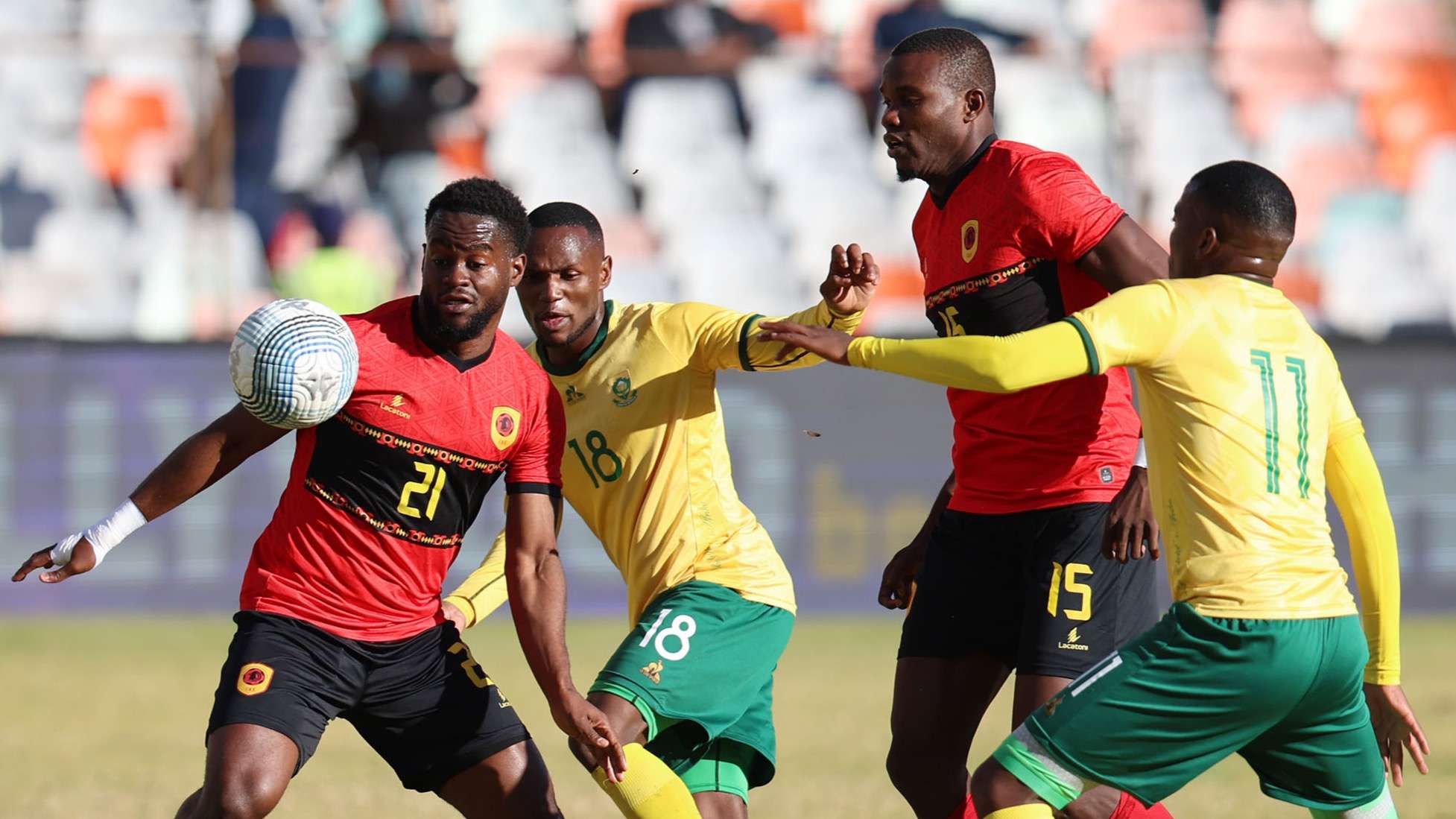 Jordy Gaspar of Angola challenged by Kabelo Dlamini & Kamogelo Sebelebele of South Africa