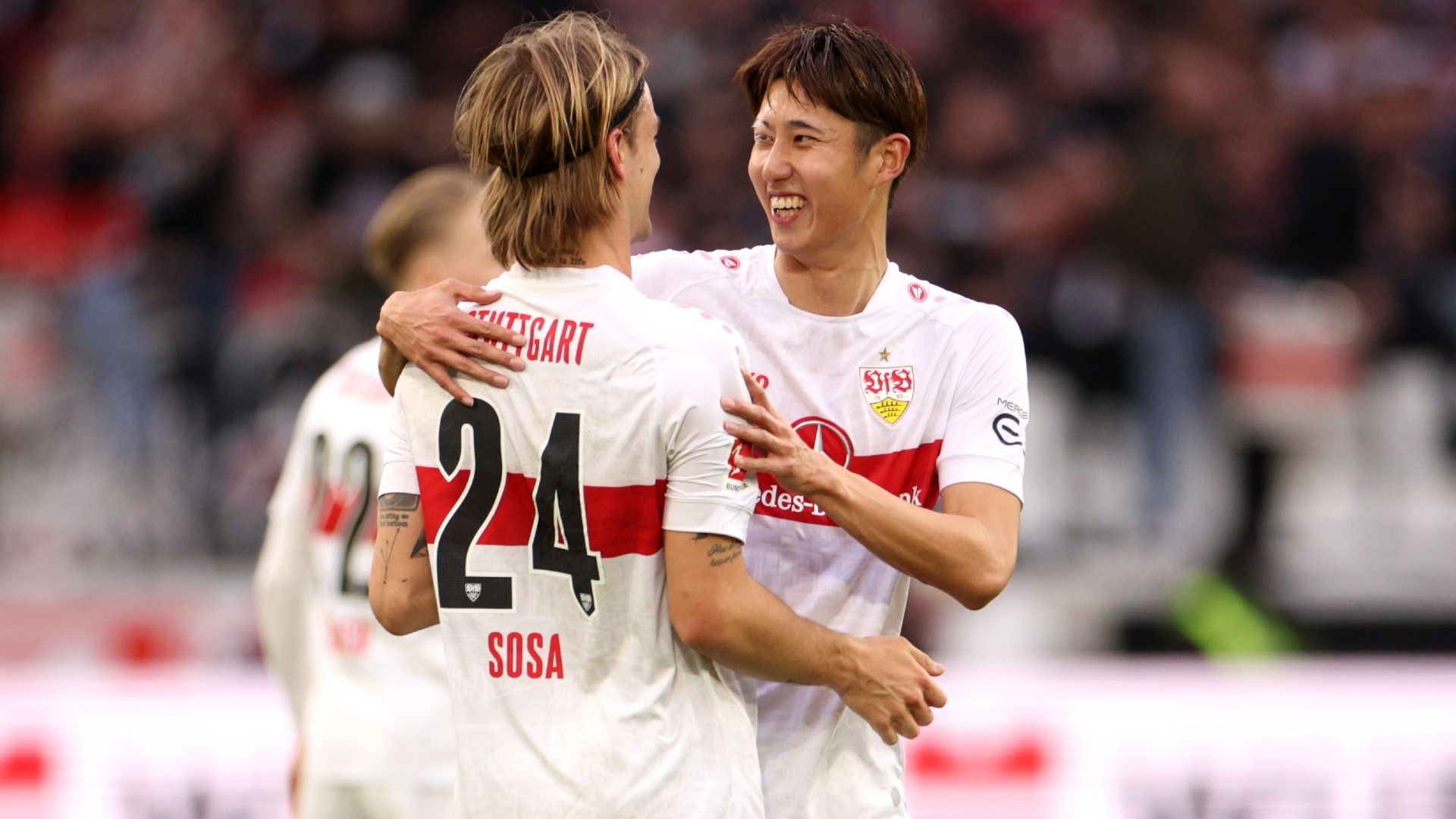 Borna Sosa of VfB Stuttgart celebrates with teammate Hiroki Ito