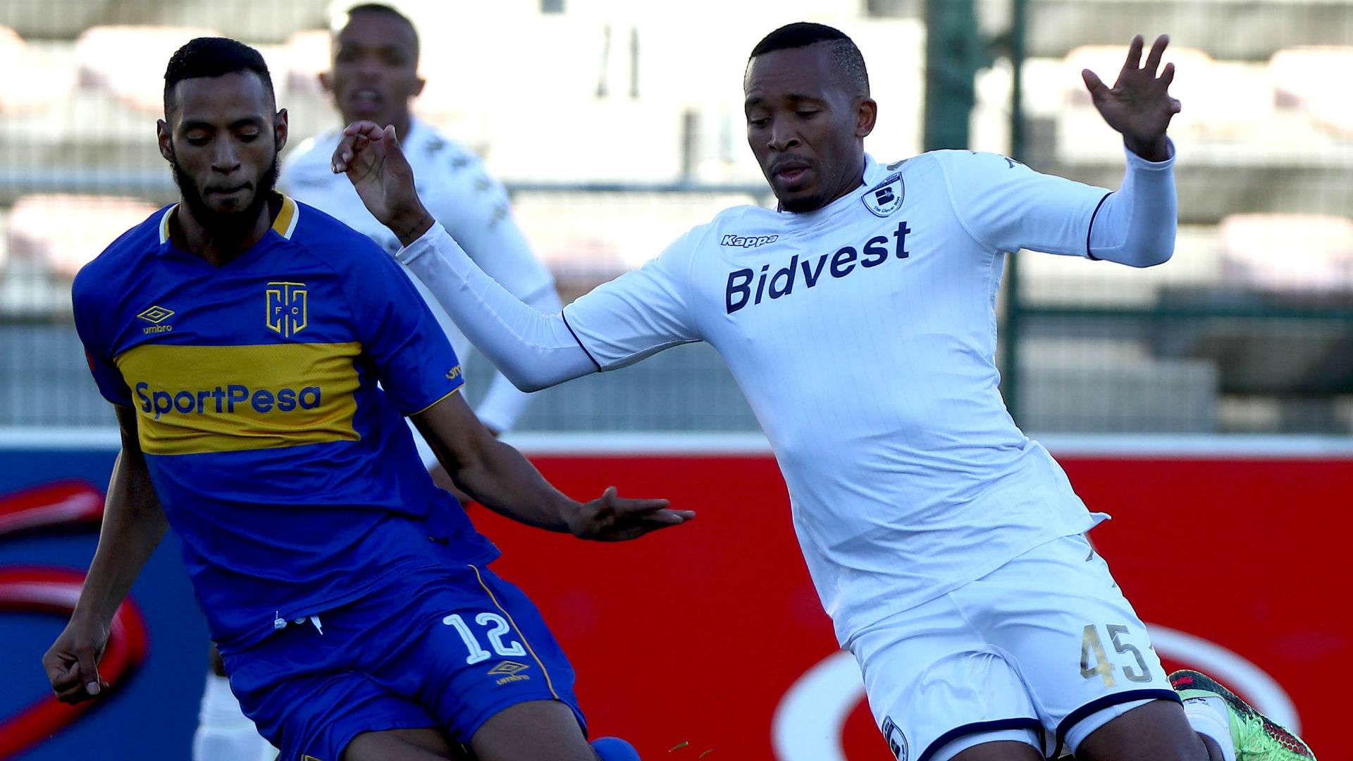 Lehlohonolo Majoro of Bidvest Wits battles for the ball with Taariq Fielies of Cape Town City