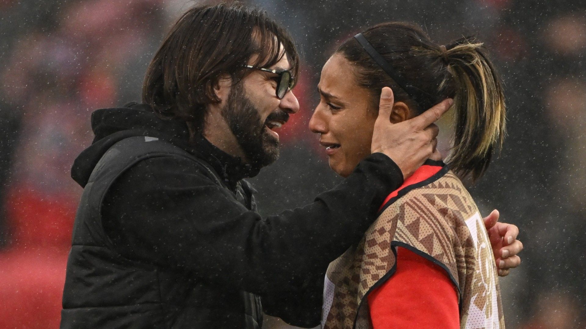 Morocco's coach Reynald Pedros (L) and Morocco's goalkeeper #12 Assia Zouhair