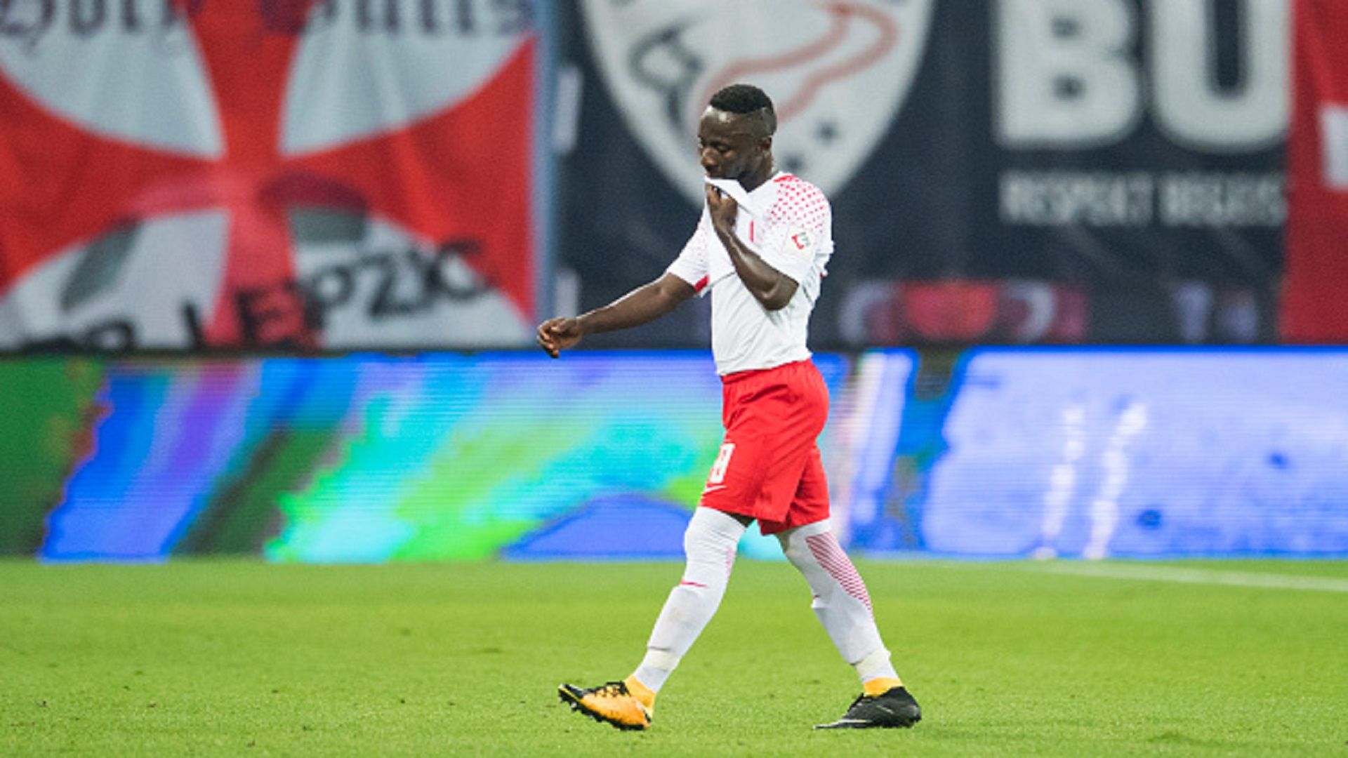 Naby Keita leaves the field after being sent off