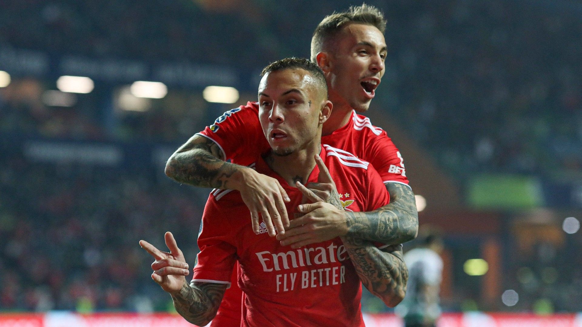 Benfica's Brazilian forward Everton (L) celebrates with Benfica's Spanish defender Alex Grimaldo