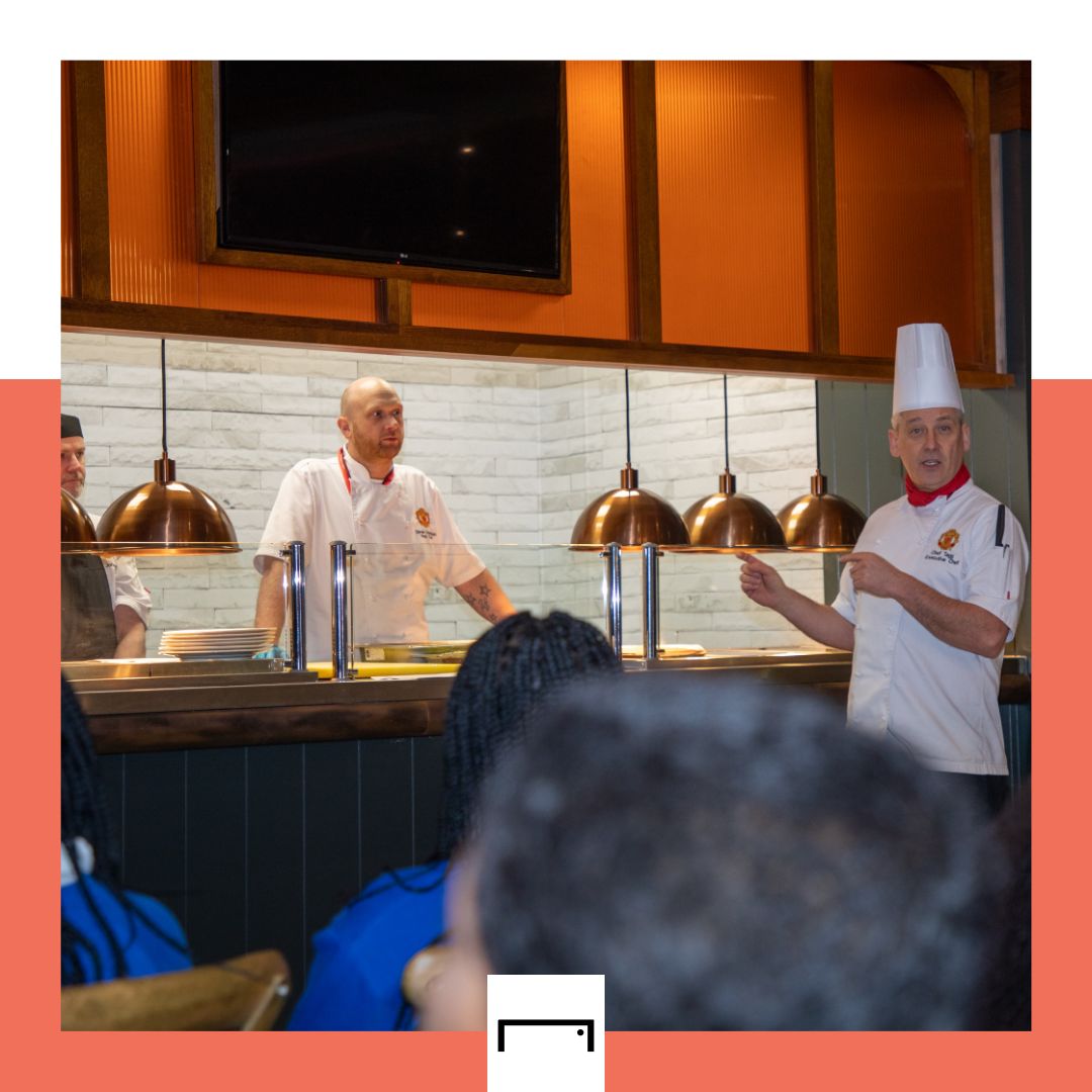 Man Utd Executive Head Chef James Tagg talks to pupils
