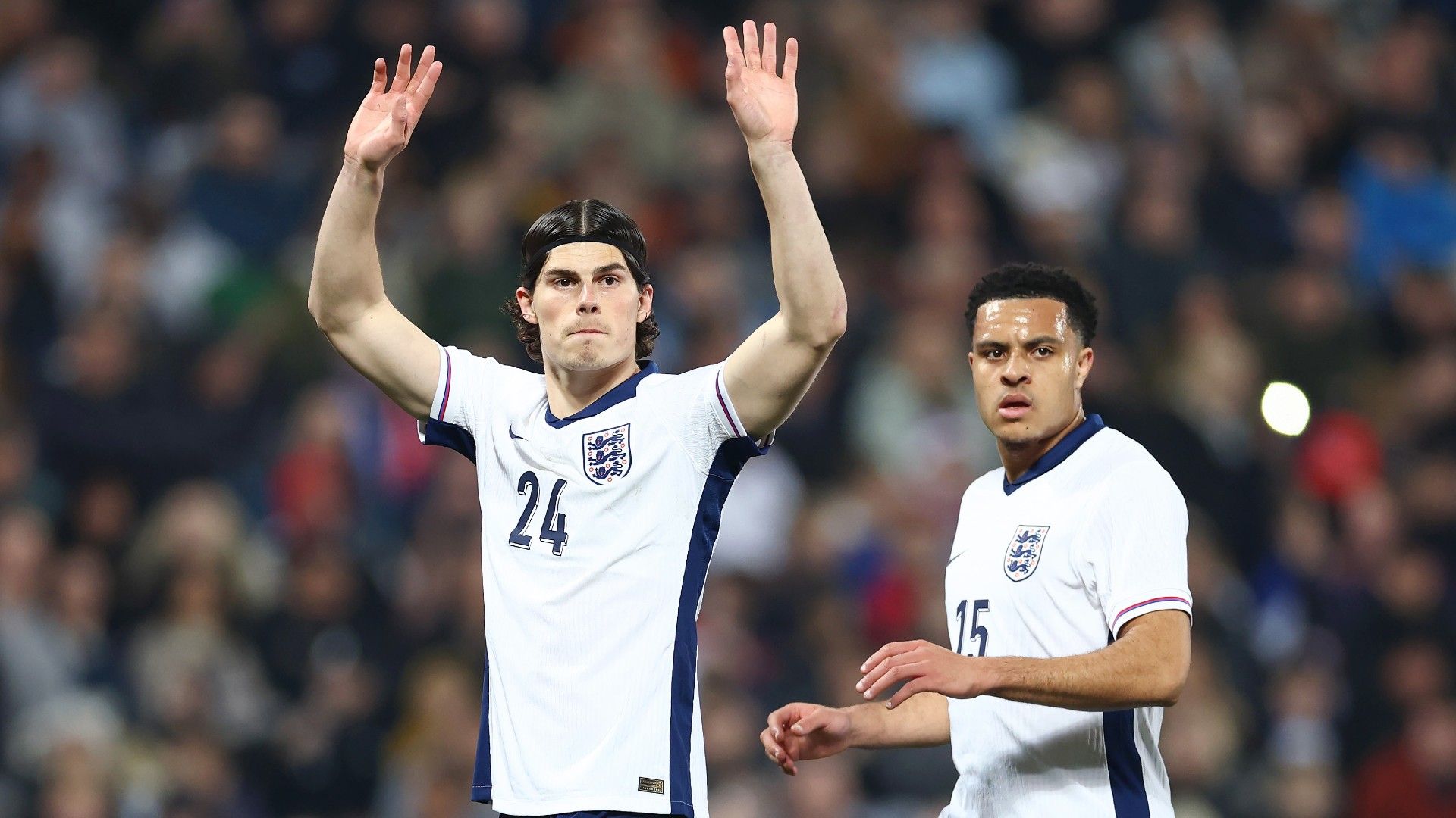 Ronnie Edwards and CJ Egan-Riley of England signal