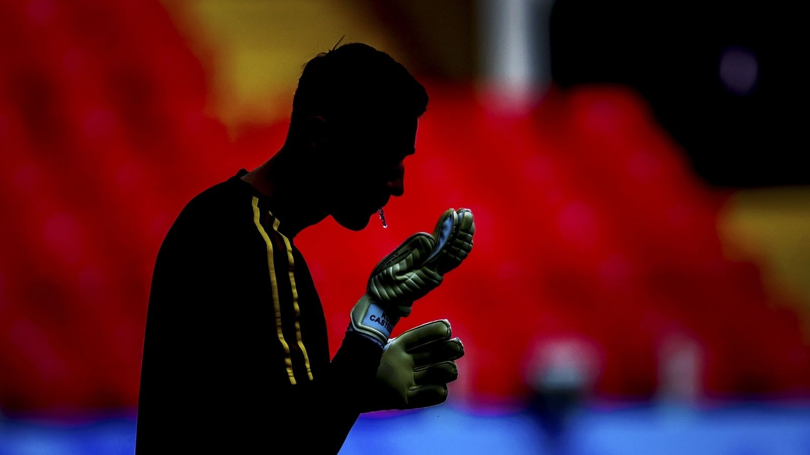Goalkeeper spit on gloves