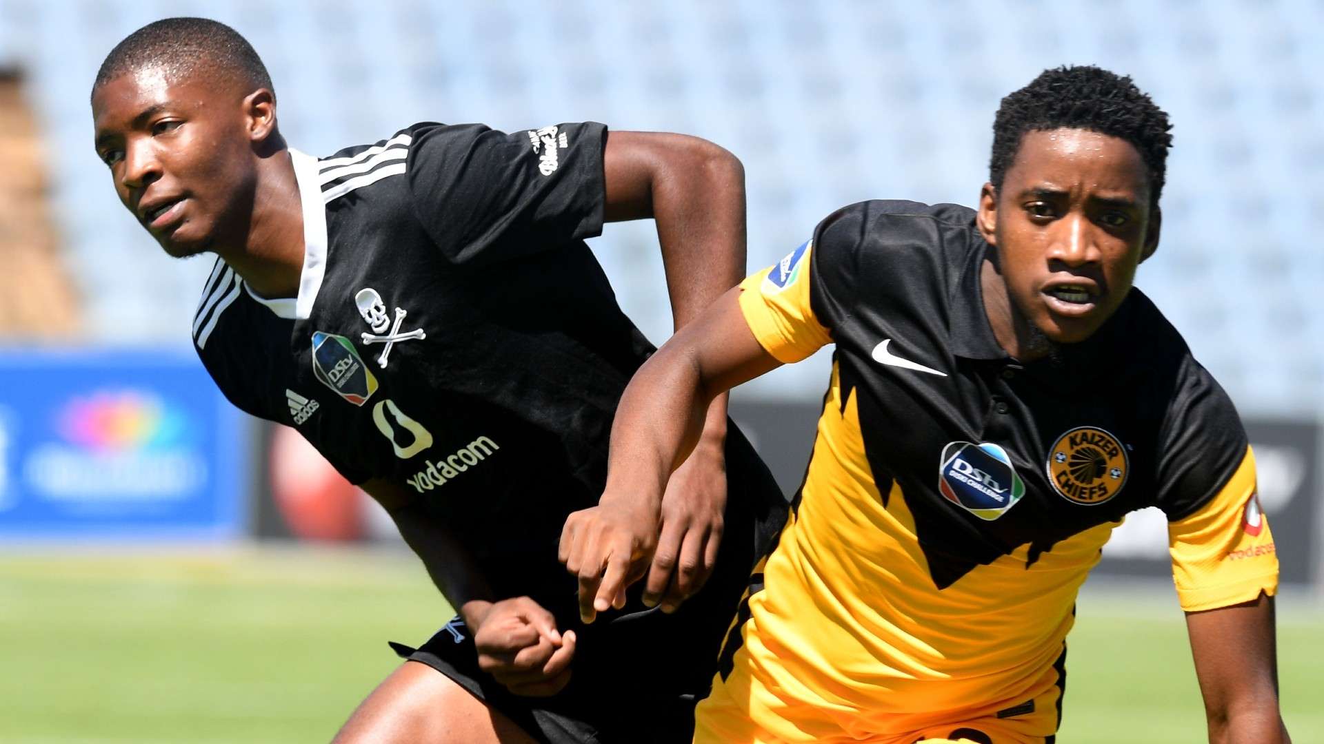 Lebohang Lesako of Kaizer Chiefs challenges Simangaliso Dlamini of Orlando Pirates.