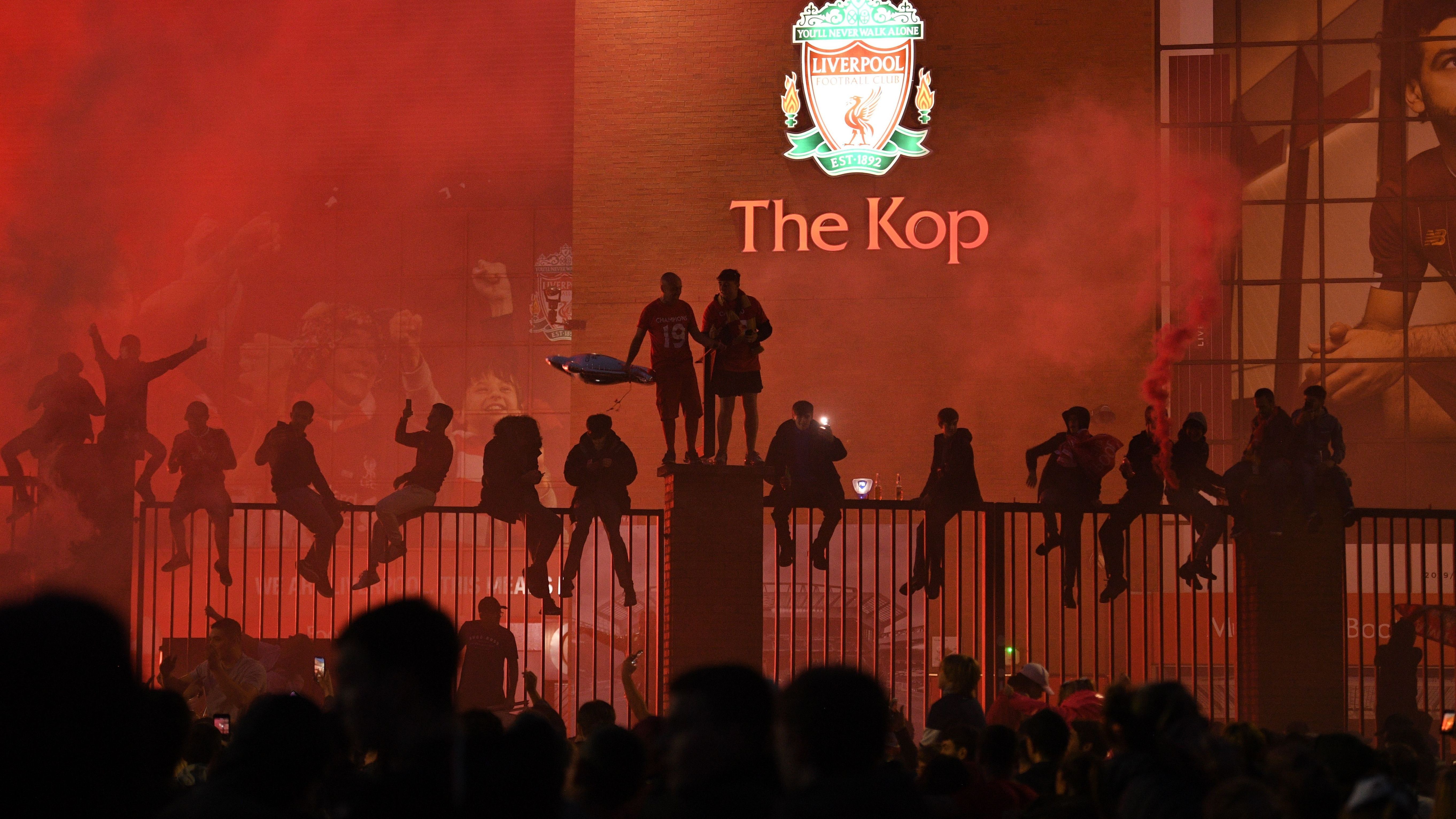 Liverpool lifts The Premier League trophy following the Premier League match between Liverpool FC and Chelsea FC at Anfield on July 22, 2020
