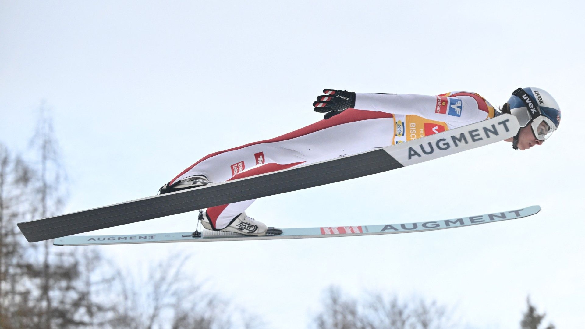 Austria's Daniel Tschofenig soars through the air