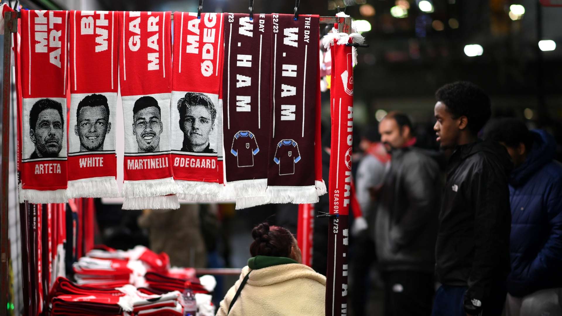  Match day scarves are seen being sold outside the stadium prior to the Premier League match between Arsenal FC and West Ham United.