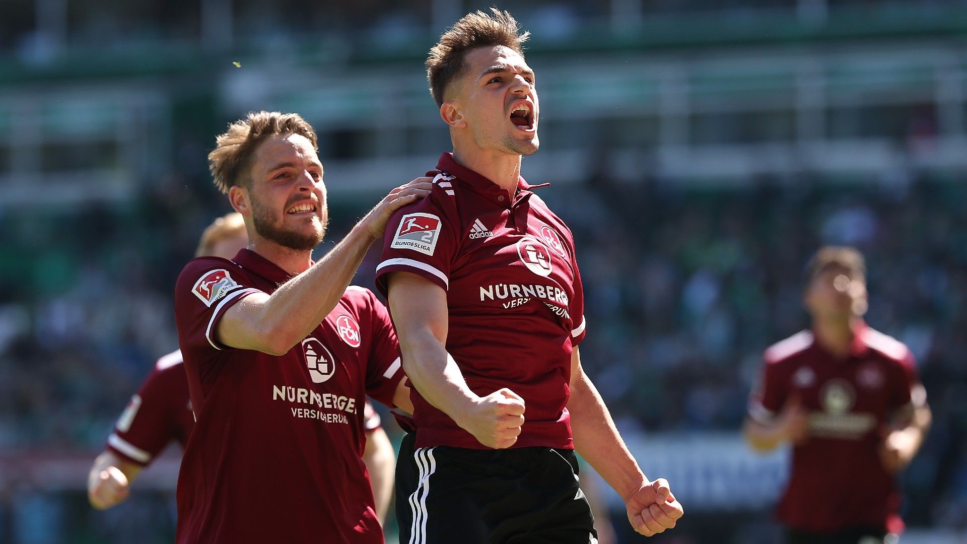 Nikola Dovedan (R) and his teammate Lukas Schleimer of 1. FC Nuernberg