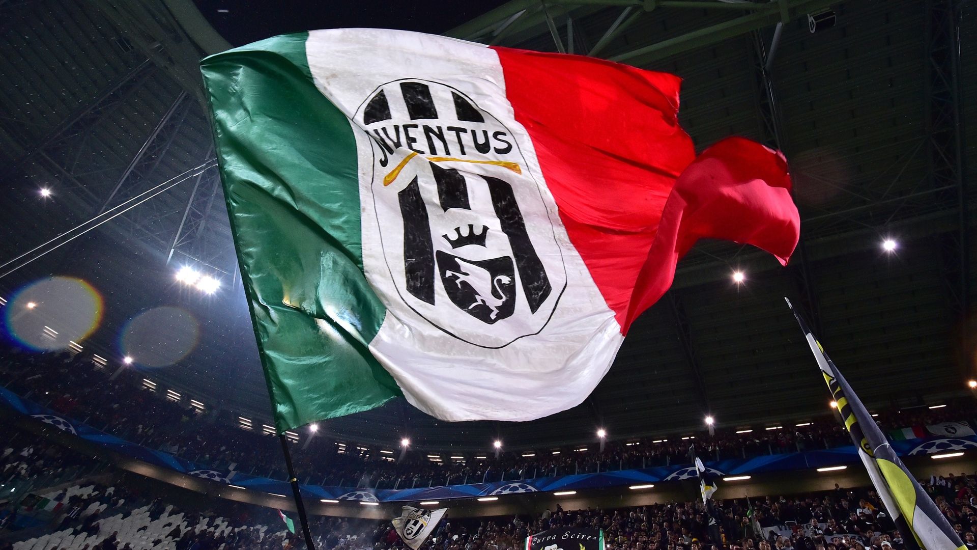 Juventus Supporters wave flags before the Italian Serie A football match