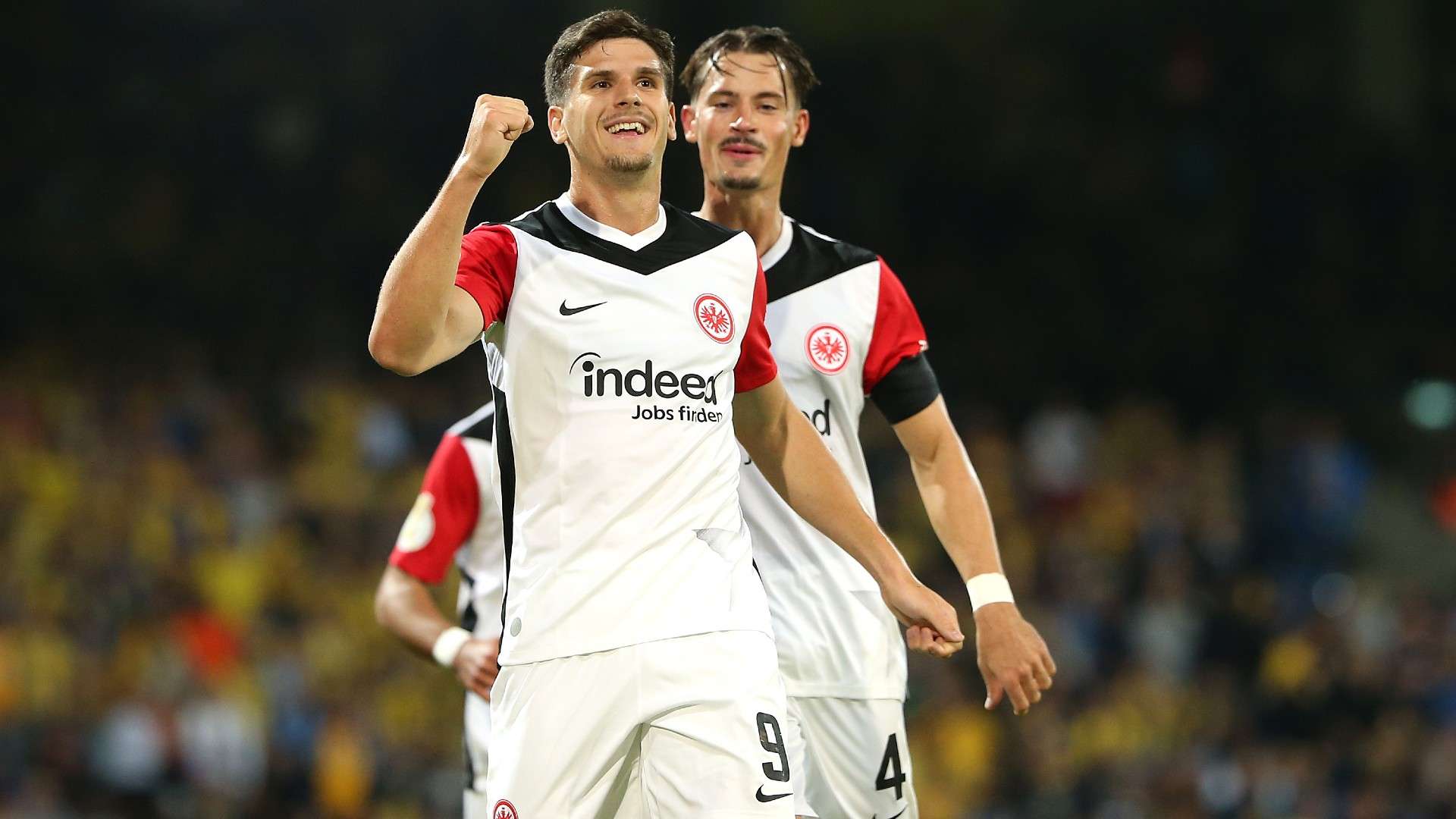 Igor Matanovic of Eintracht Frankfurt celebrates with teammate Robin Koch