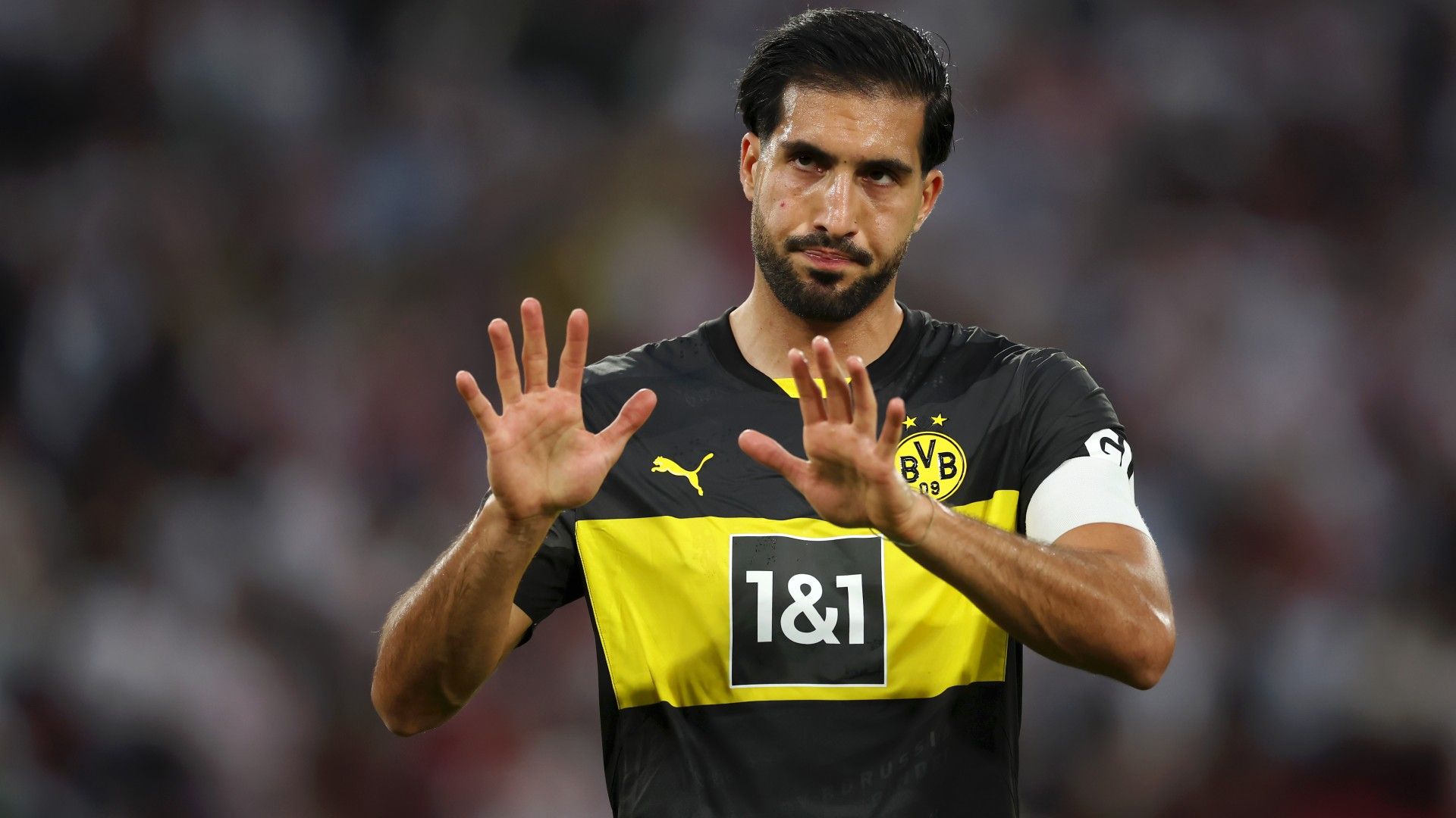 Emre Can of Borussia Dortmund acknowledges the fans