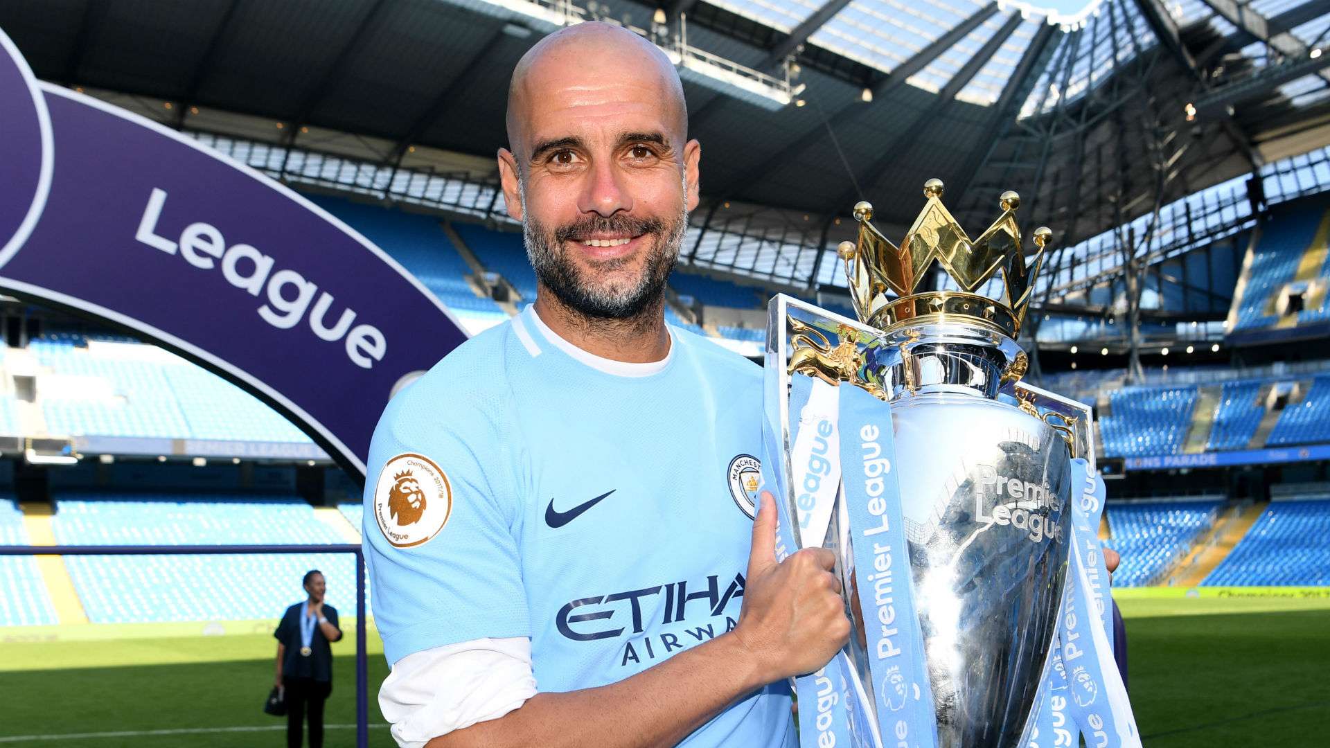 Pep Guardiola Manchester City Premier League trophy