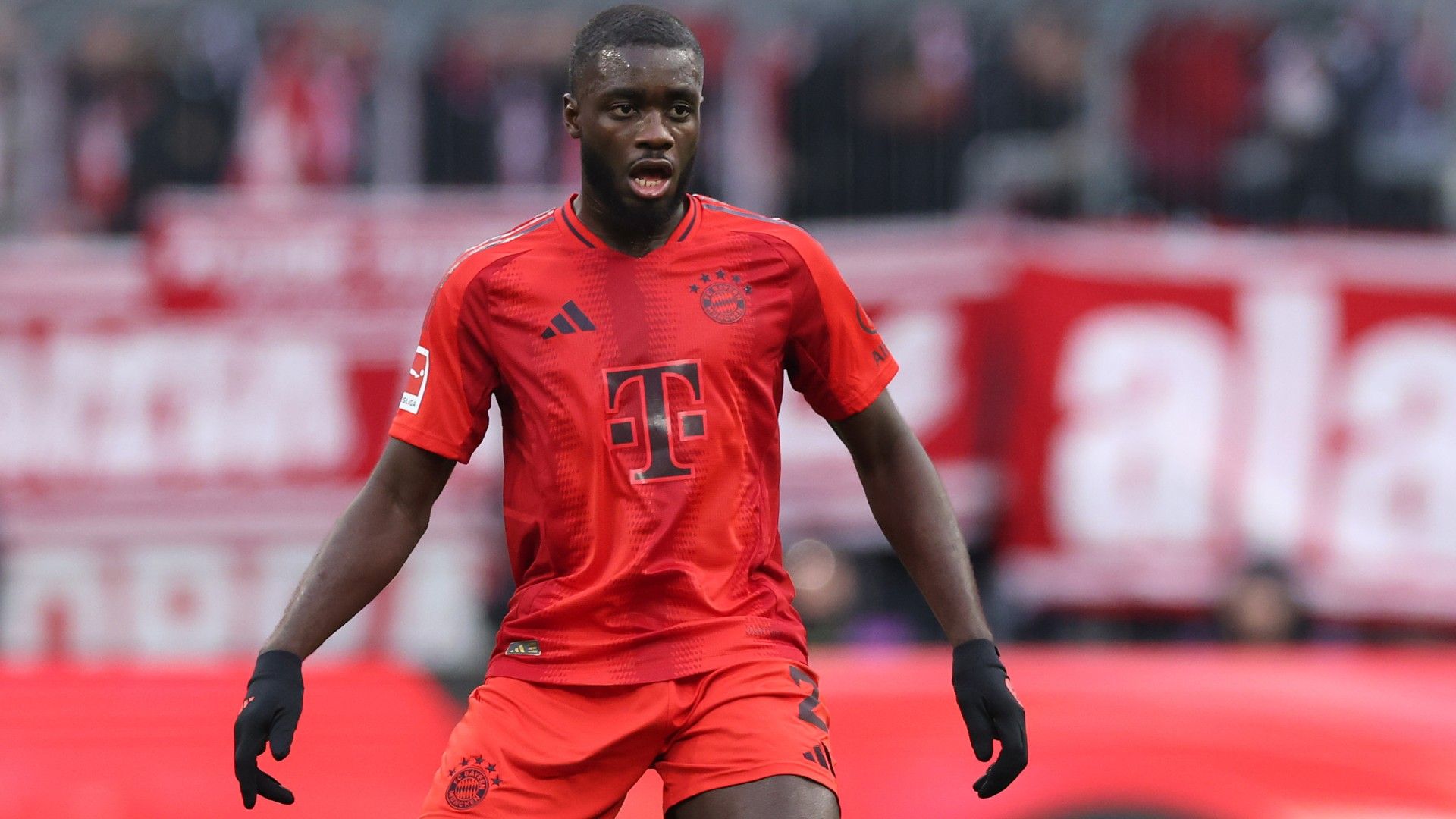 Dayot Upamecano of FC Bayern München runs with the ball 