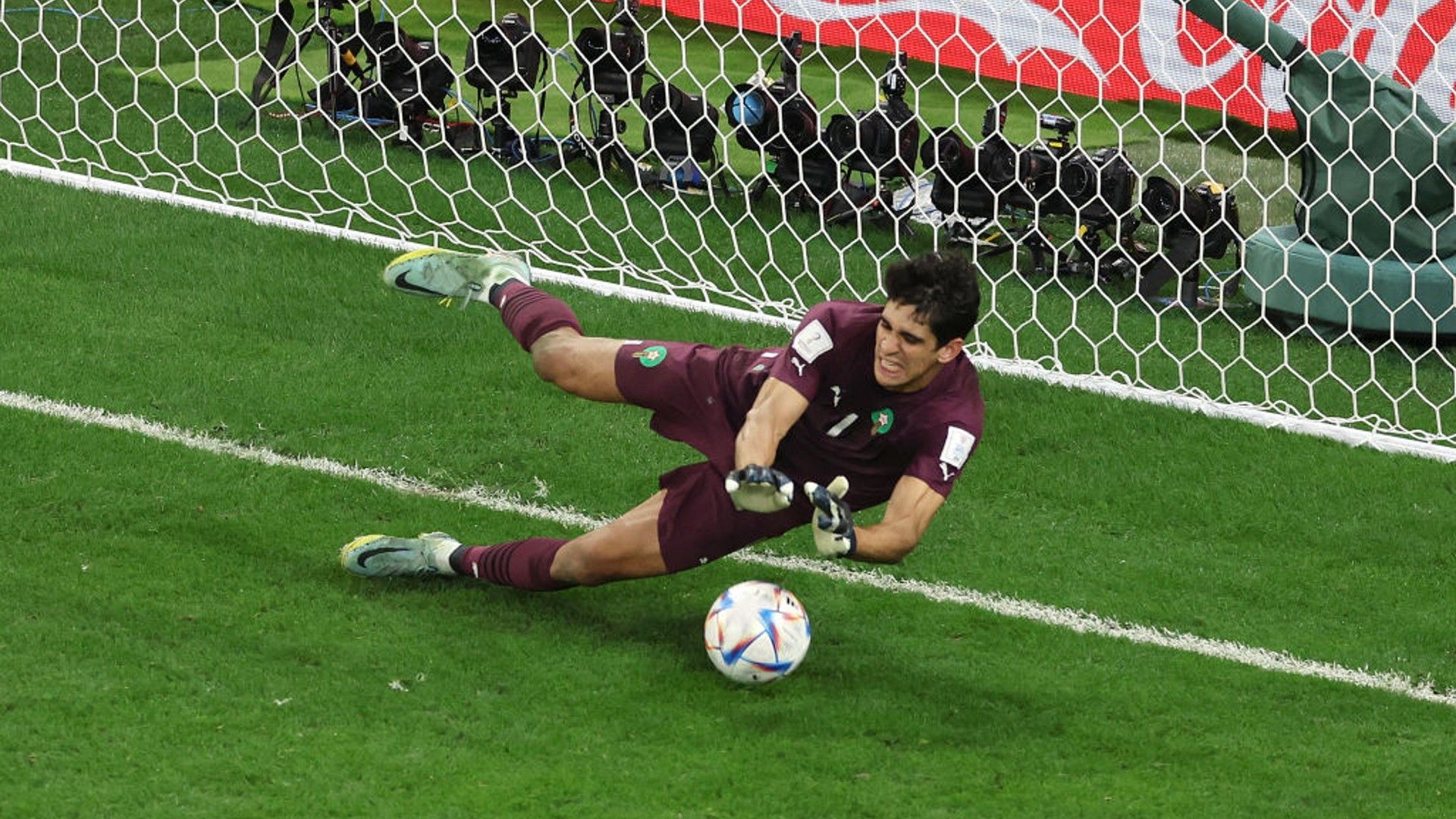Yassine Bounou saves a penalty. 