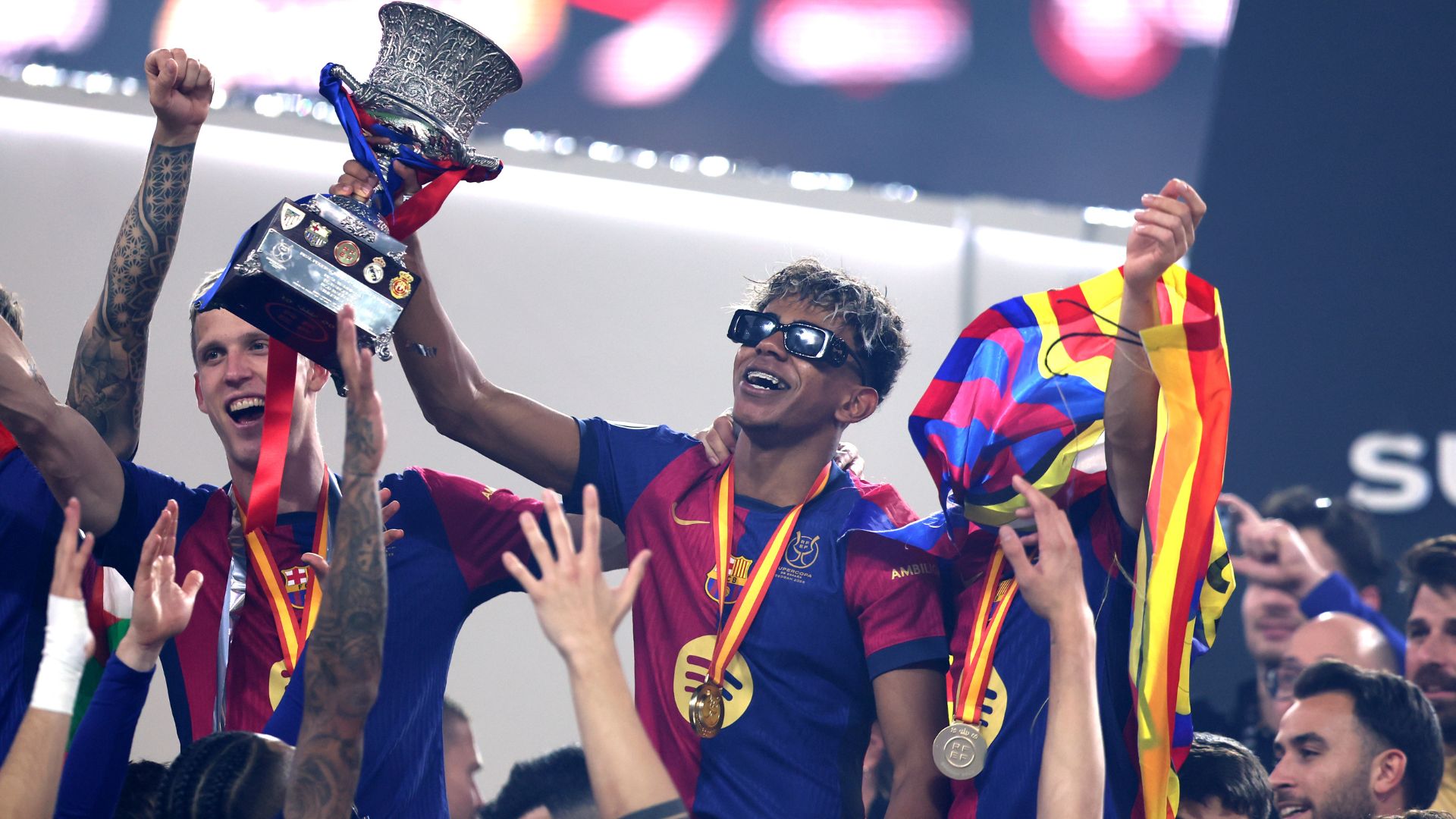 Lamine Yamal of FC Barcelona celebrates with the Supercopa de Espana trophy