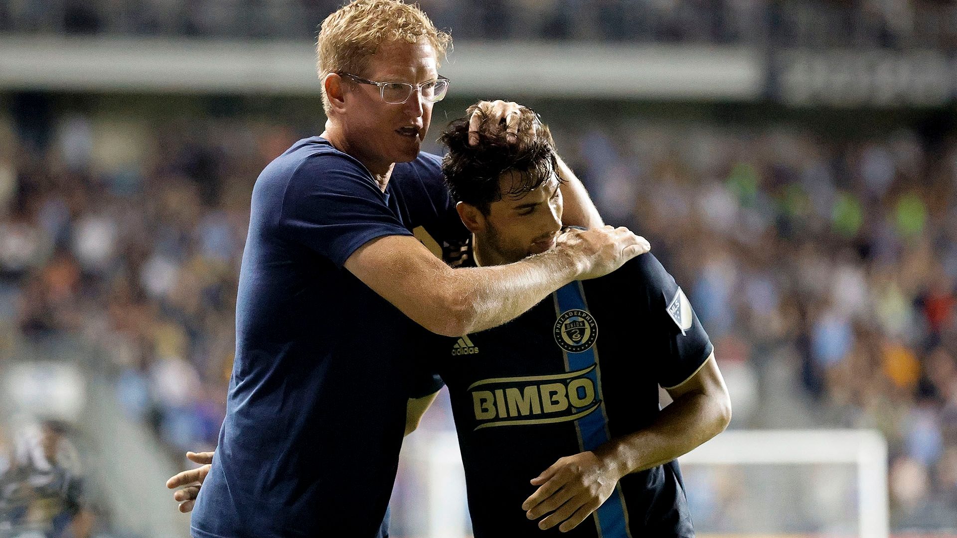 Jim Curtin Union hug player