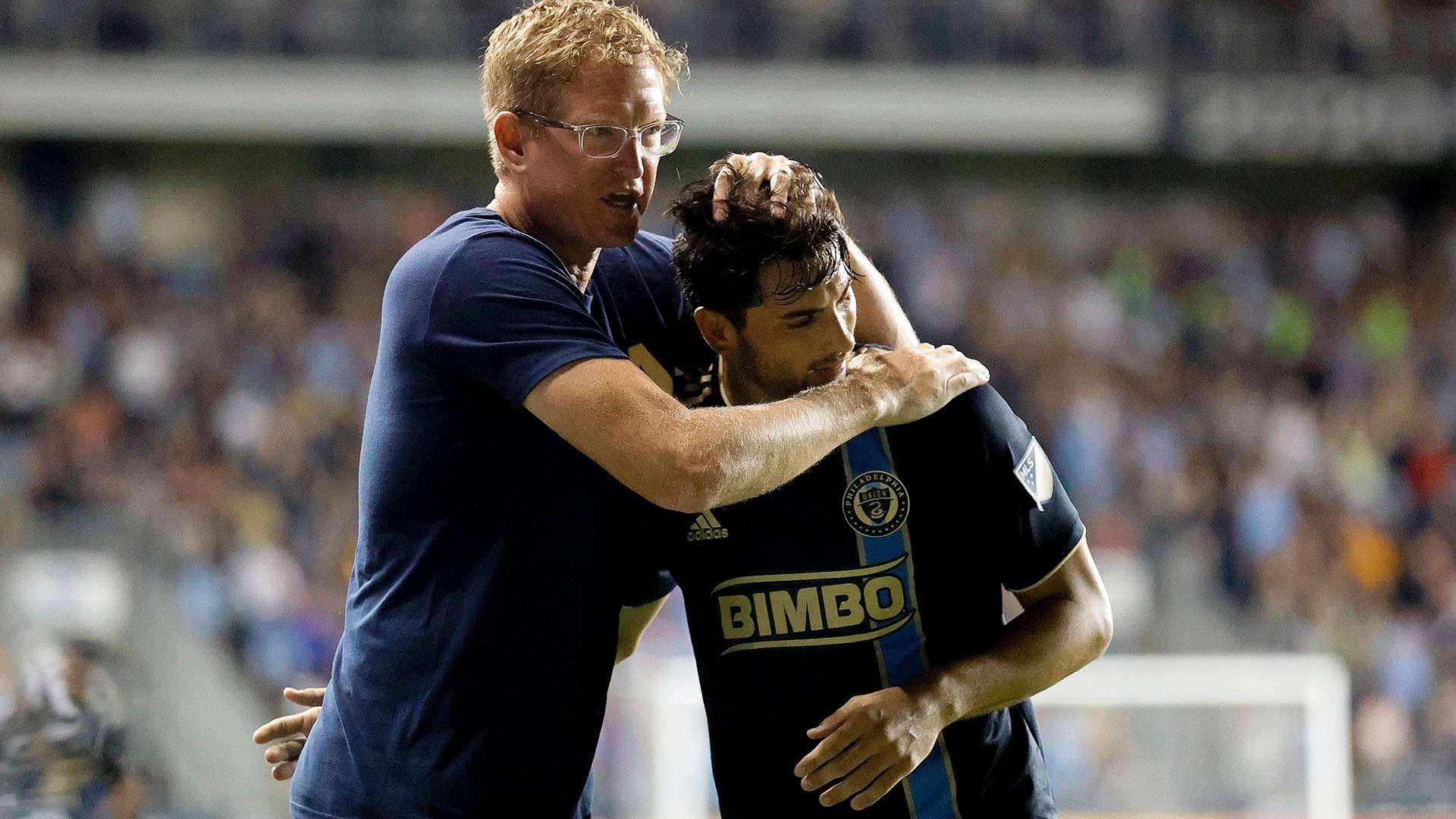 Jim Curtin Union hug player
