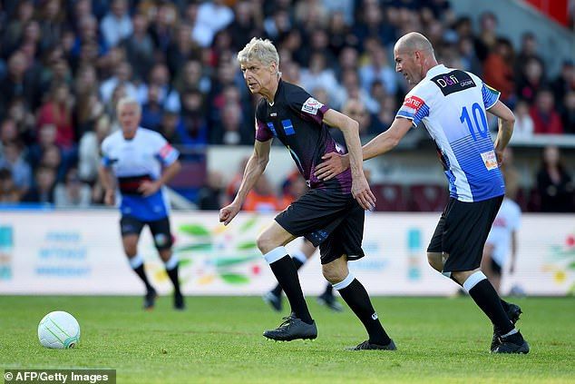 Arsene Wenger dribbles past ZInedine Zidane