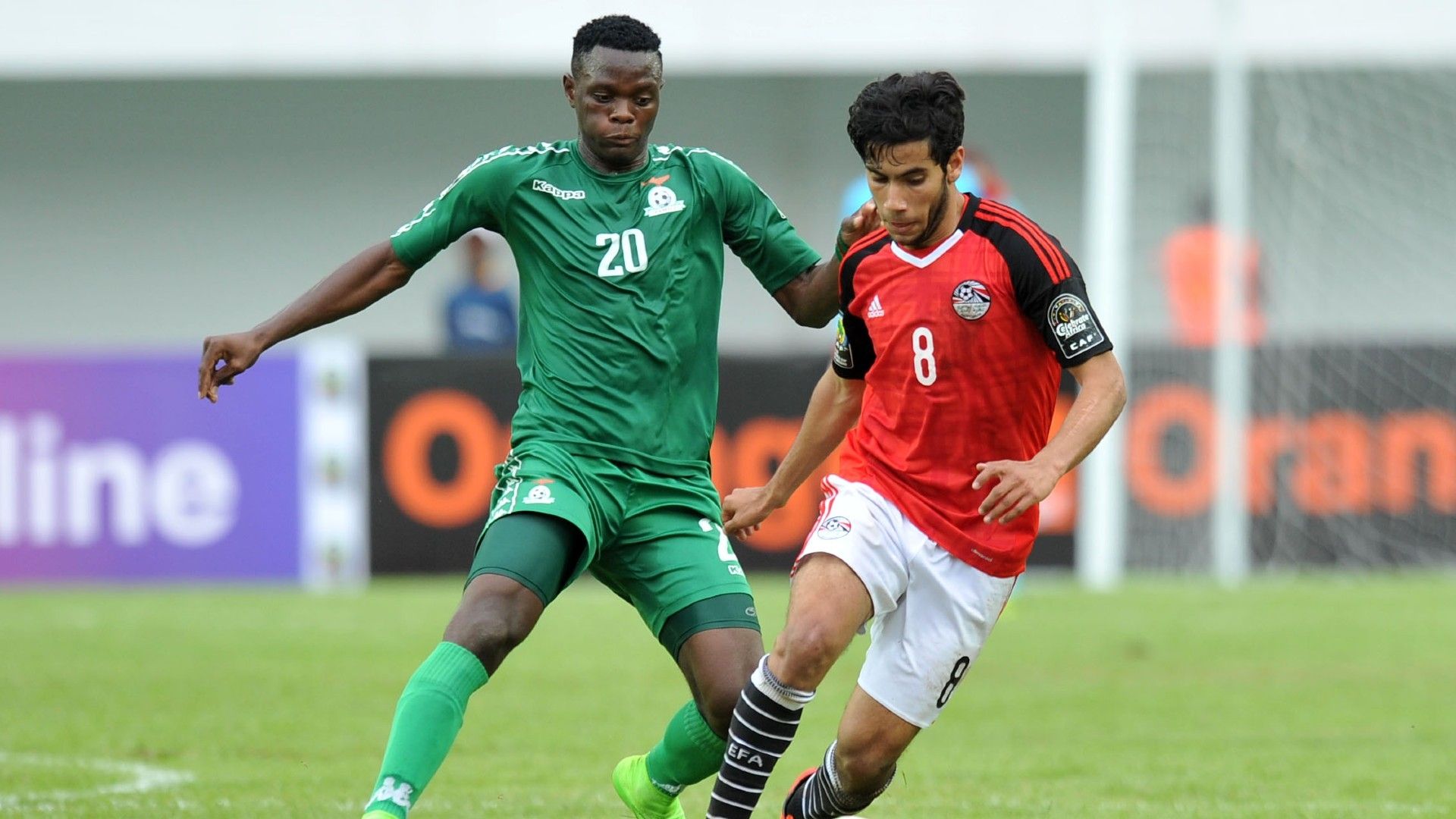 Nasser Elhamid of Egypt challenged by Patson Daka of Zambia.