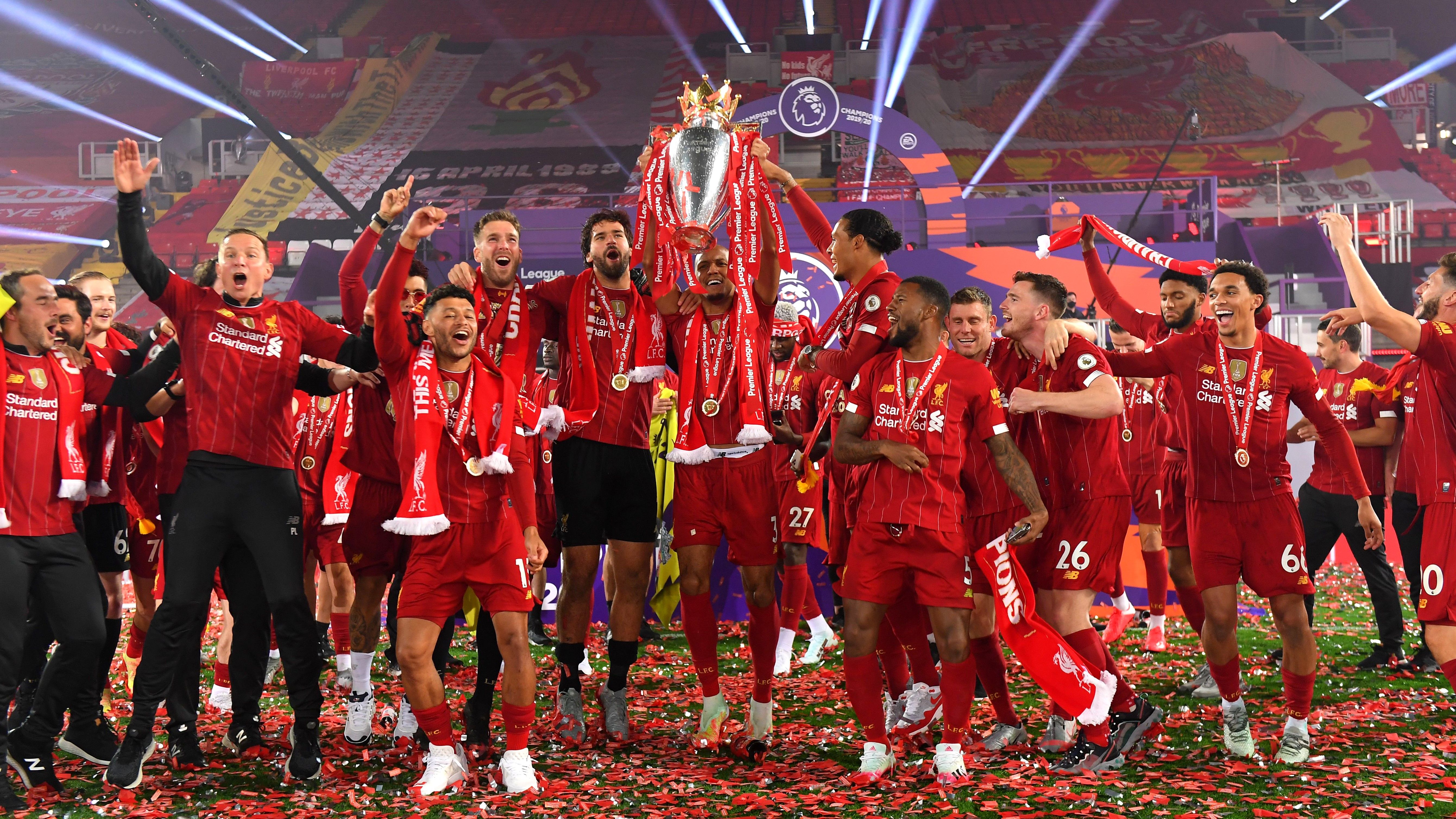 Liverpool lifts The Premier League trophy following the Premier League match between Liverpool FC and Chelsea FC at Anfield on July 22, 2020