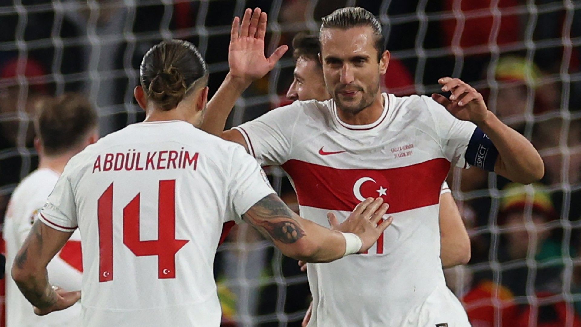 Turkey's midfielder #11 Yusuf Yazici (R) celebrates  