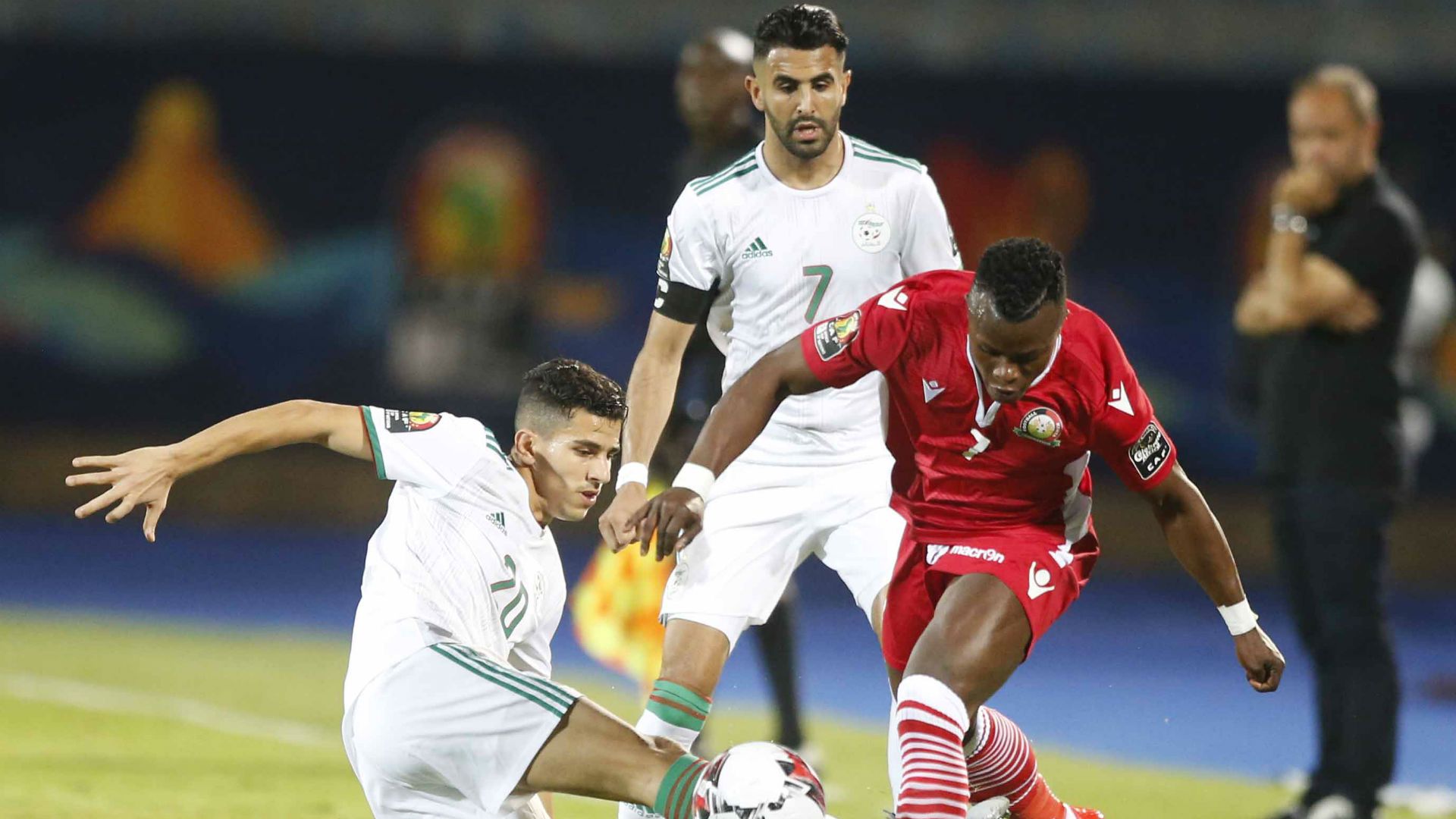 YOUCEF ATAL of Algeria and Riyad Mahrez v AYUB TIMBE of Kenya Harambee Stars.