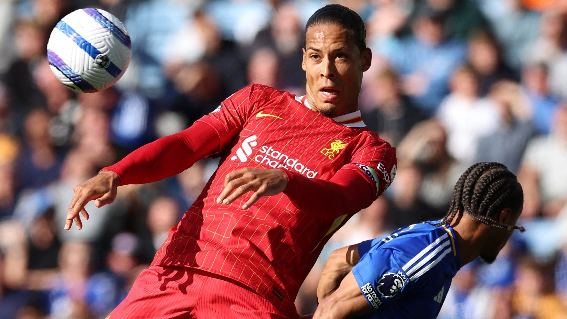 Liverpool's Dutch defender #04 Virgil van Dijk (L) vies with Leicester City's Jamacan striker #14 Bobby Decordova-Reid (R)