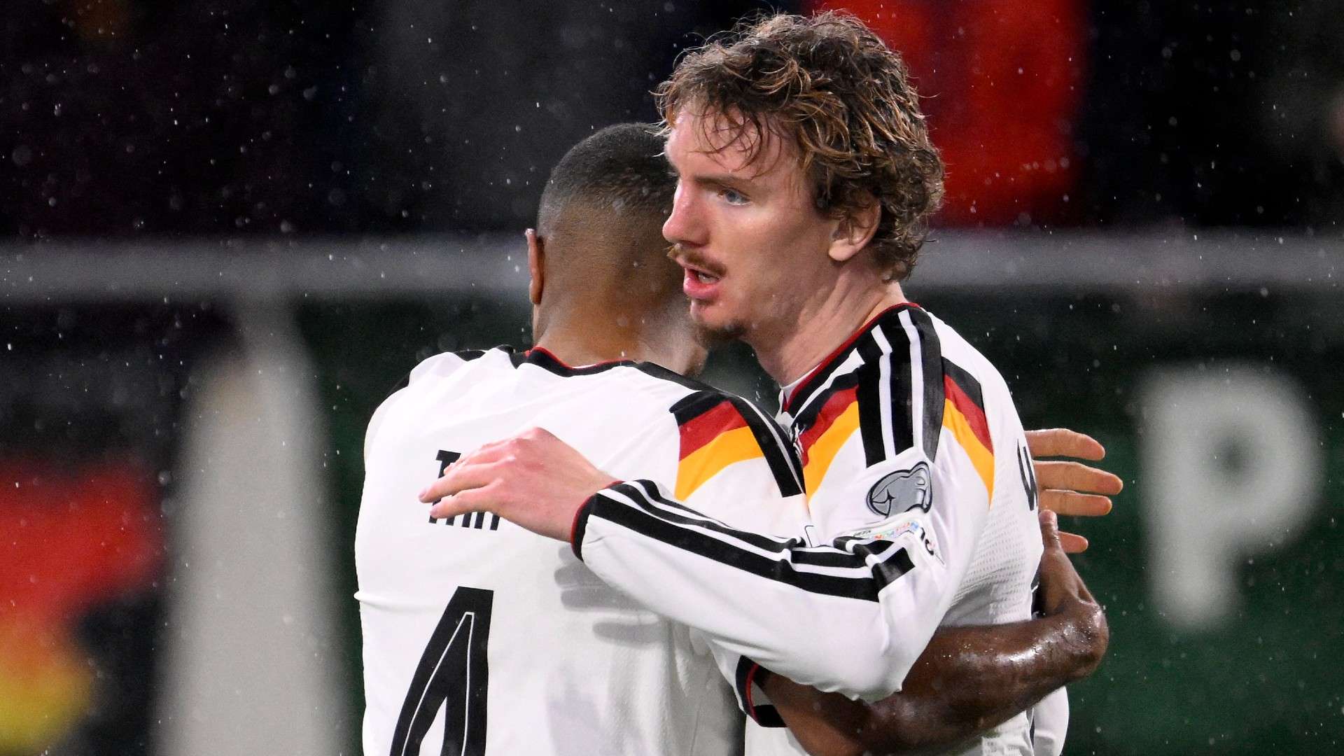 Germany's forward #11 Nick Woltemade (R) celebrates scoring