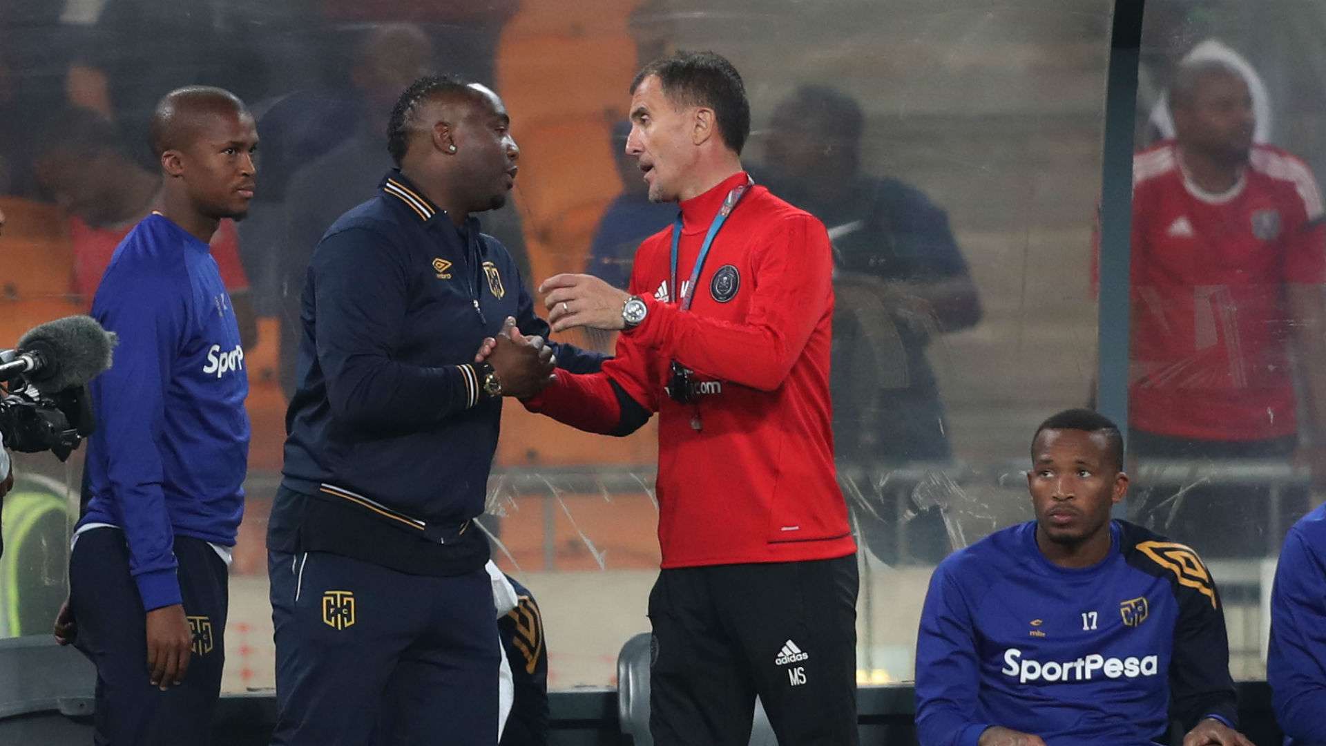 Cape Town City coach Benni McCarthy with Orlando Pirates mentor Milutin Sredojevic, while Tshepo Gumede & Lehlohonolo Majoro look on.