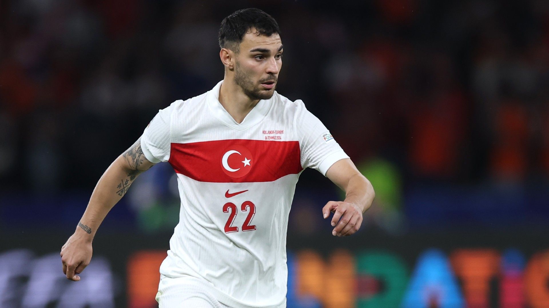 Kaan Ayhan of Turkiye controls the ball