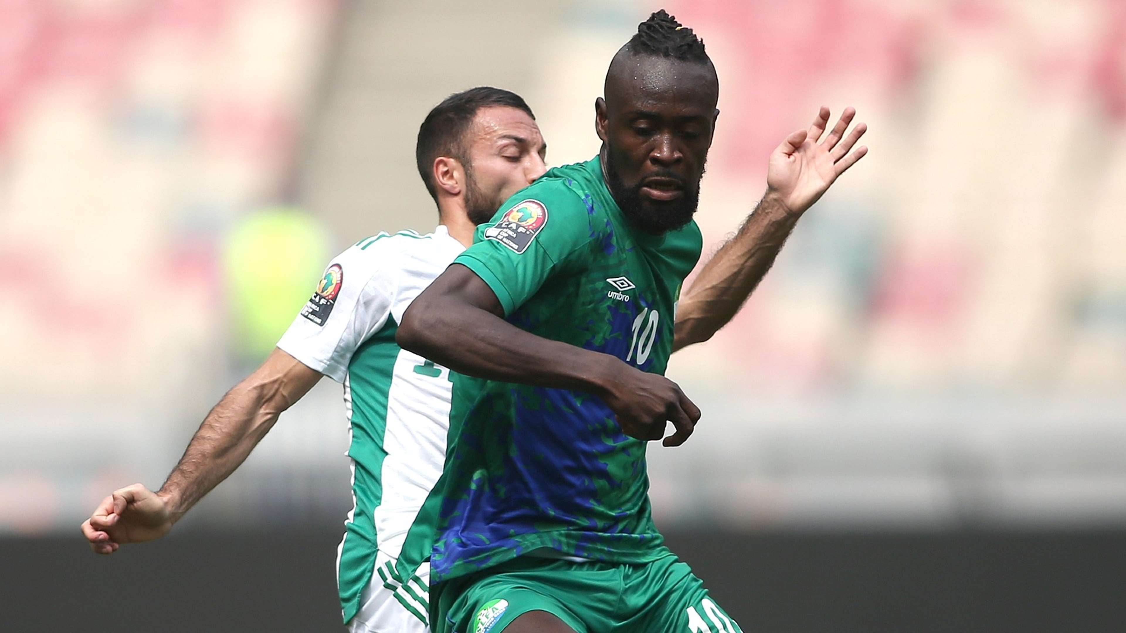 Haris Belkebla of Algeria challenges Kei Kamara of Sierra Leone.