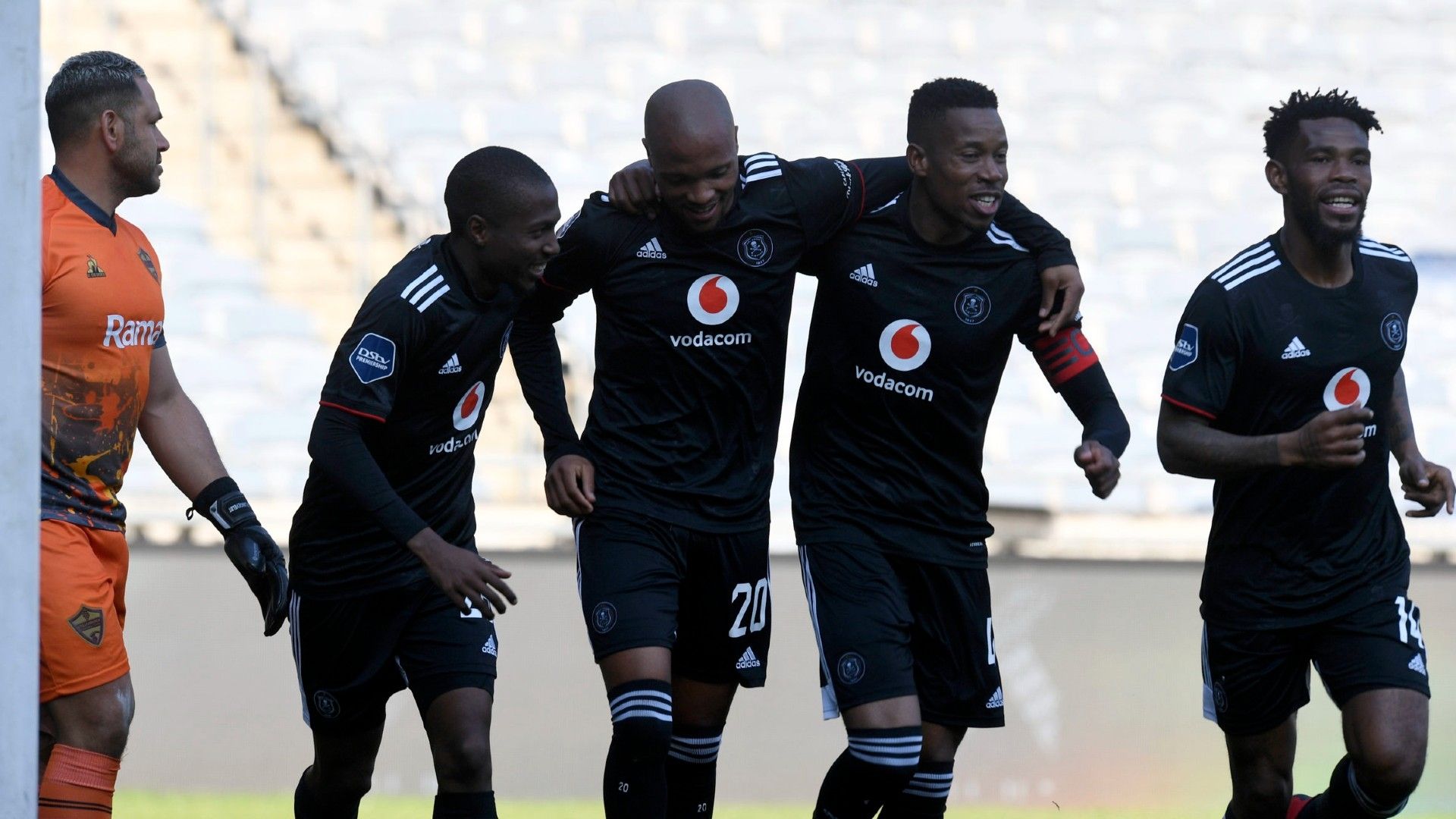 Goodman Mosele of Orlando Pirates celebrates goal with teammates.