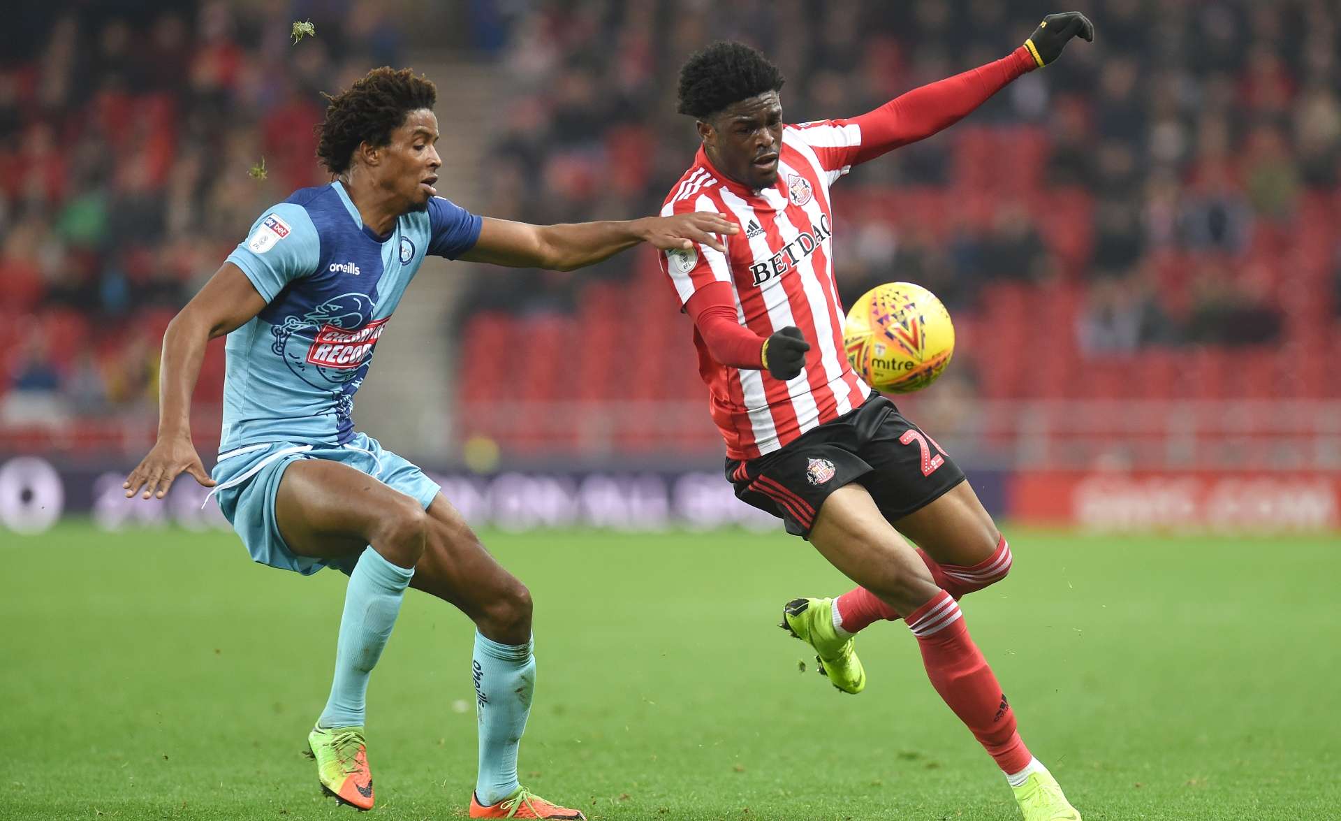 Josh Maja of Sunderland is challenged by Sido Jombati of Wycombe Wanderers